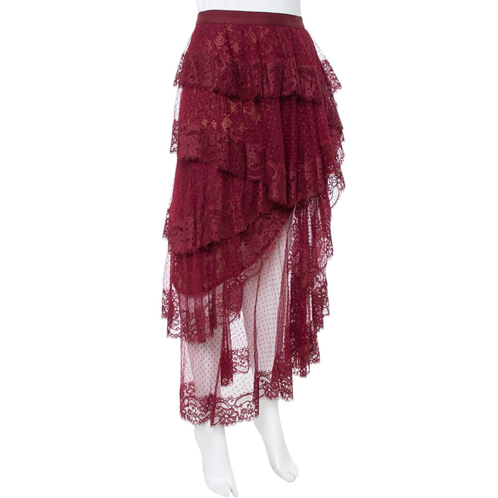 Feminine aesthetics and comfortable style pretty much define this skirt from the house of Elie Saab. Crafted in tulle fabric, it features ruffle detailing all over in a tiered style. It is designed in an asymmetric silhouette and can be styled with
