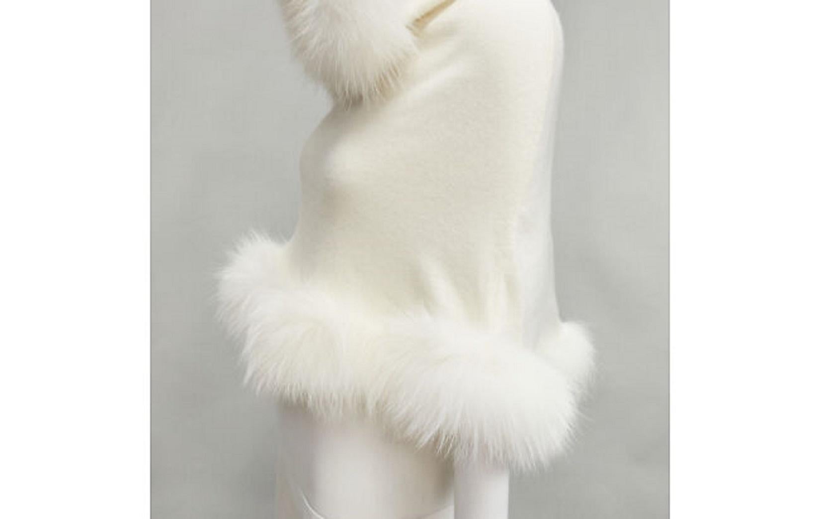 ELIE SAAB cream cashmere white fur trim knitted hooded poncho cape
Reference: AAWC/A00229
Brand: Elie Saab
Material: Wool, Cashmere
Color: Beige
Pattern: Solid
Extra Details: Fur trim along hood and hem.
Made in: Italy

CONDITION:
Condition: