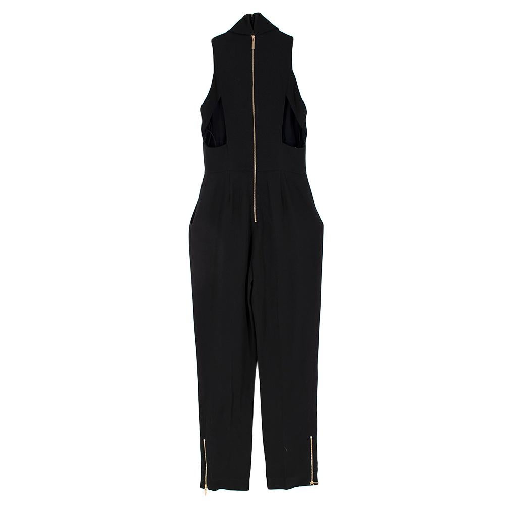 Elie Saab High Neck Black Jumpsuit with Cutouts 

-Sleveless elegant design
-Split cleavage 
-Luxurious silk lining
-Triangular cutouts from the side to back 
-Golden hardware branded zip fastenings at the back and trousers 
-2 Functional pockets