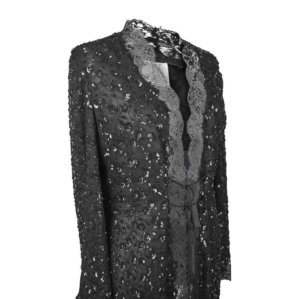 Guaranteed authentic Elie Saab stunning lace and sequin evening jacket. 
Entire jacket is edged in exquisite fine lace with an intermittent subtle sheen.
Gentle bell sleeve.
Body of knee length jacket is lace adorned with black sequins and