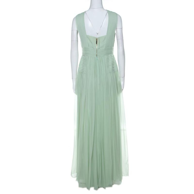 You will love the way you look when you slip this dress on. It is an Elie Saab design, wonderfully tailored from silk and beautified with pleats and a floor-length hemline. A pair of gold sandals and a shimmery clutch will complete the dress to