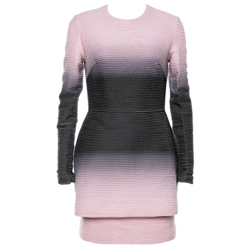 We've constantly fallen in love with Mister Saab's lovely designs and continue to do so with this beautiful pink dress! It features a flattering layered silhouette and a ribbed design. It has a round neckline and long sleeves and comes equipped with