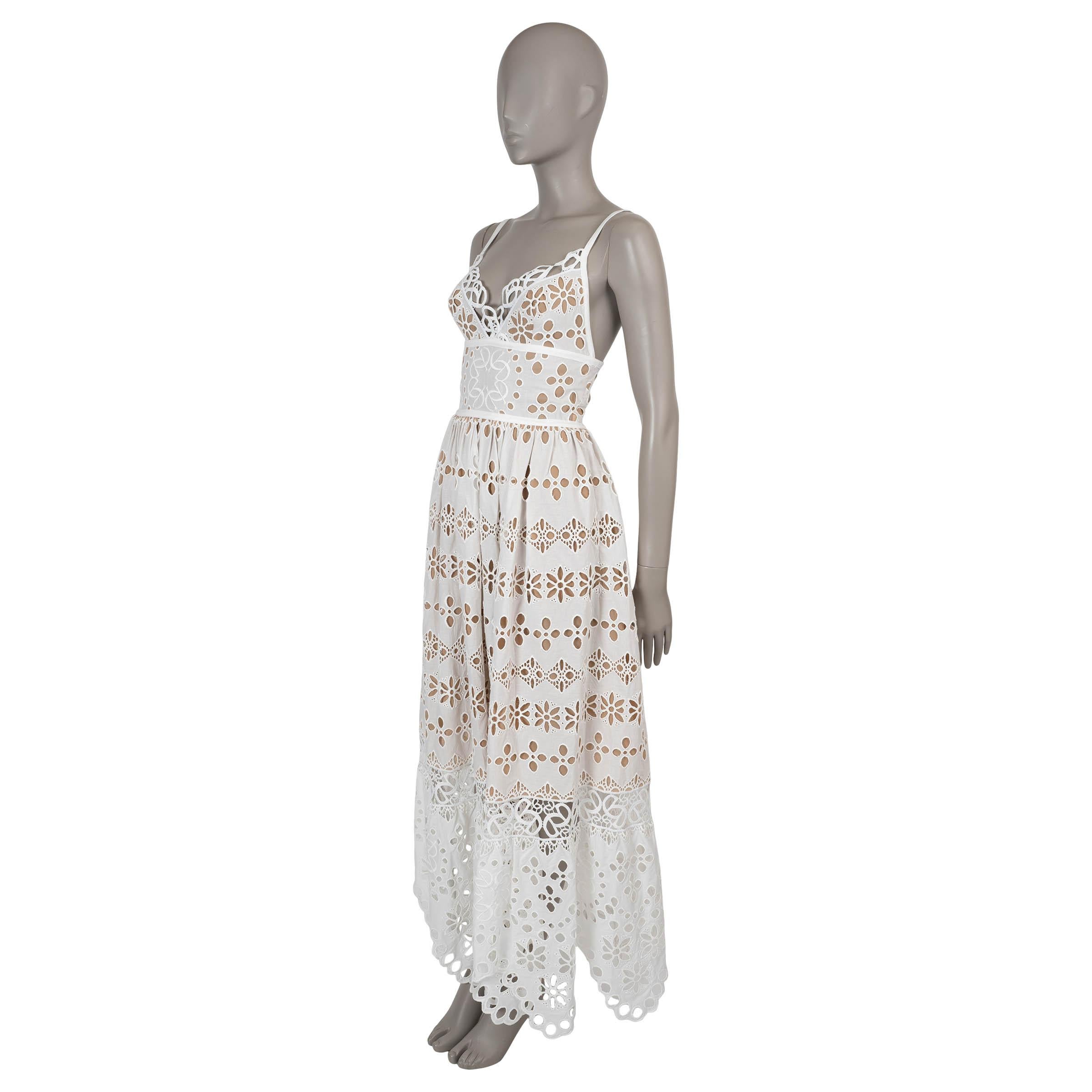 This 100% authentic Elie Saab dress in powder white broderie anglaise cotton and silk is the epitome of ethereal elegance. Designed with a sleeveless fit-and-flare silhouette, it flows to a graceful maxi length, accentuated by delicate spaghetti