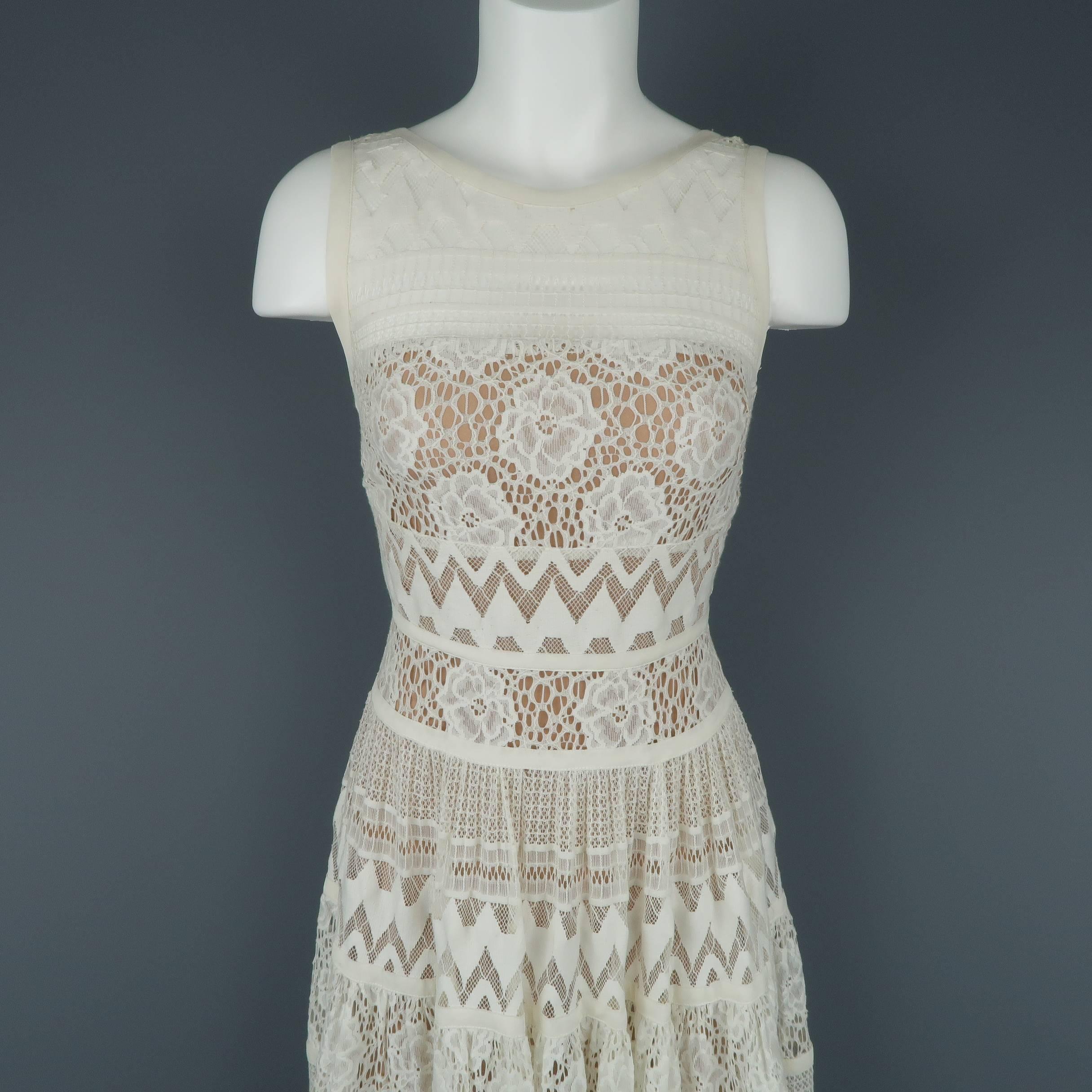 ELIE SAAB maxi peasant style dress comes in cream mixed lace patterns with a high scoop neck front, maxi A line skirt, and thick strap back. Tan silk liner.
 
Excellent Pre-Owned Condition.
Marked: FR 36
 
Measurements:
 
Shoulder: 12 in.
Bust: 34