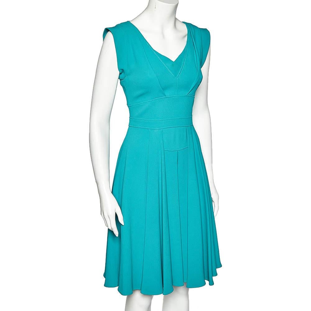 This dress midi dress personifies grace and femininity in every way. A creation from the House of Elie Saab, this midi dress is tailored skillfully using teal-blue crepe material with pleated details. Pair this piece with stilettoes and matching