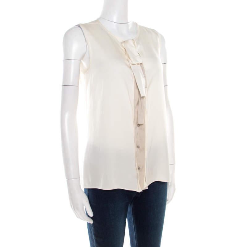 The Elie Tahari collection offers a diverse range of the best styles for all women. Wear this cream blouse and watch everyone give you all the attention at a formal meeting. This blended silk piece lets you embrace the inner fashionista in you.

