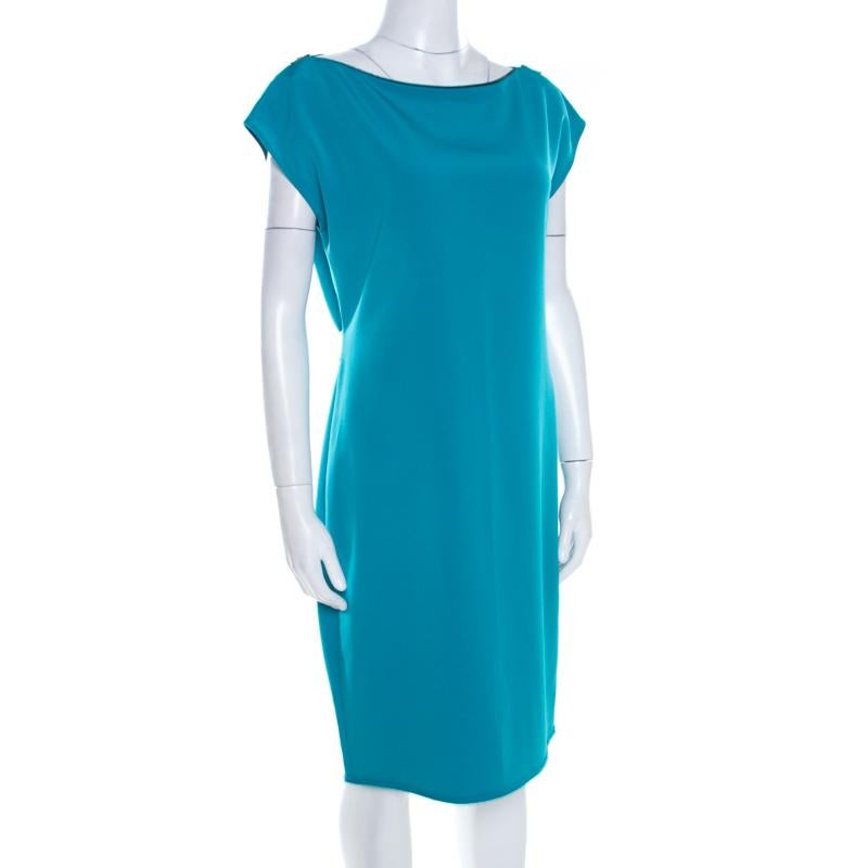 Get complimented for your effortless styling when you wear this green piece from the house of Elie Tahari. This shift dress features a zipper neck detail, a frayed hem and a belt design on the back. This is masterfully tailored in blended fabric to