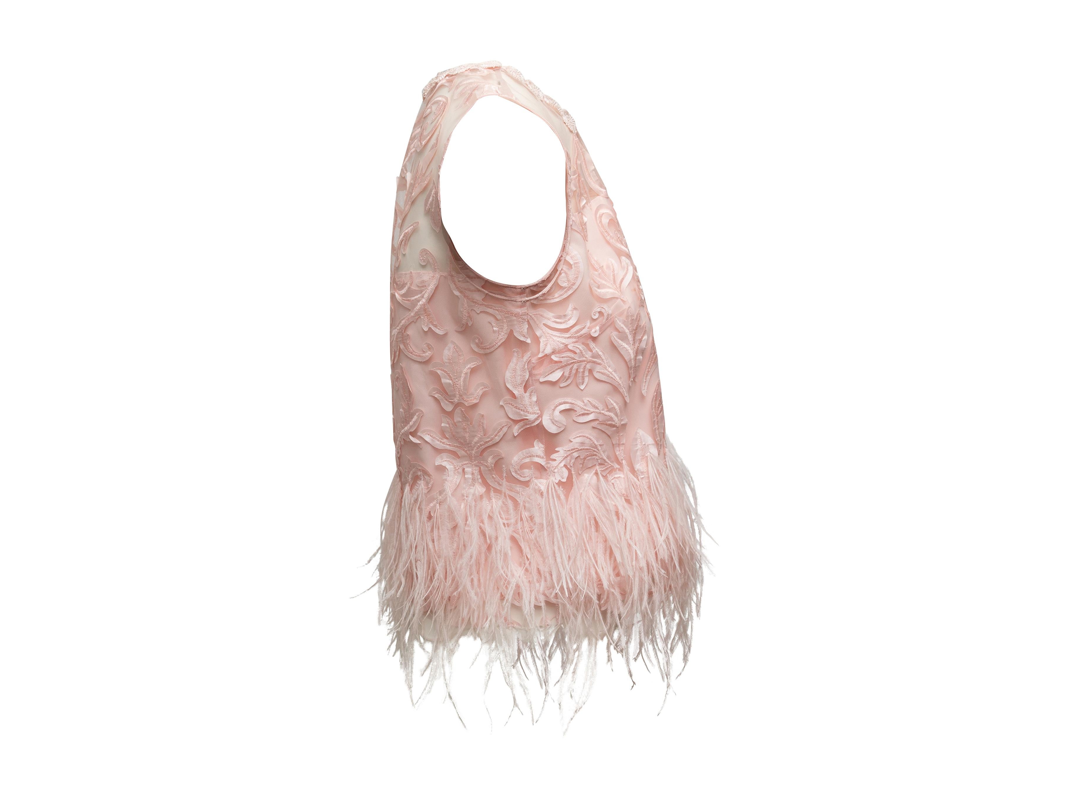 Product details: Light pink sleeveless top by Elie Tahari. Lace trim at crew neck. Applique embroidered detailing throughout. Ostrich feather trim at hem. 37