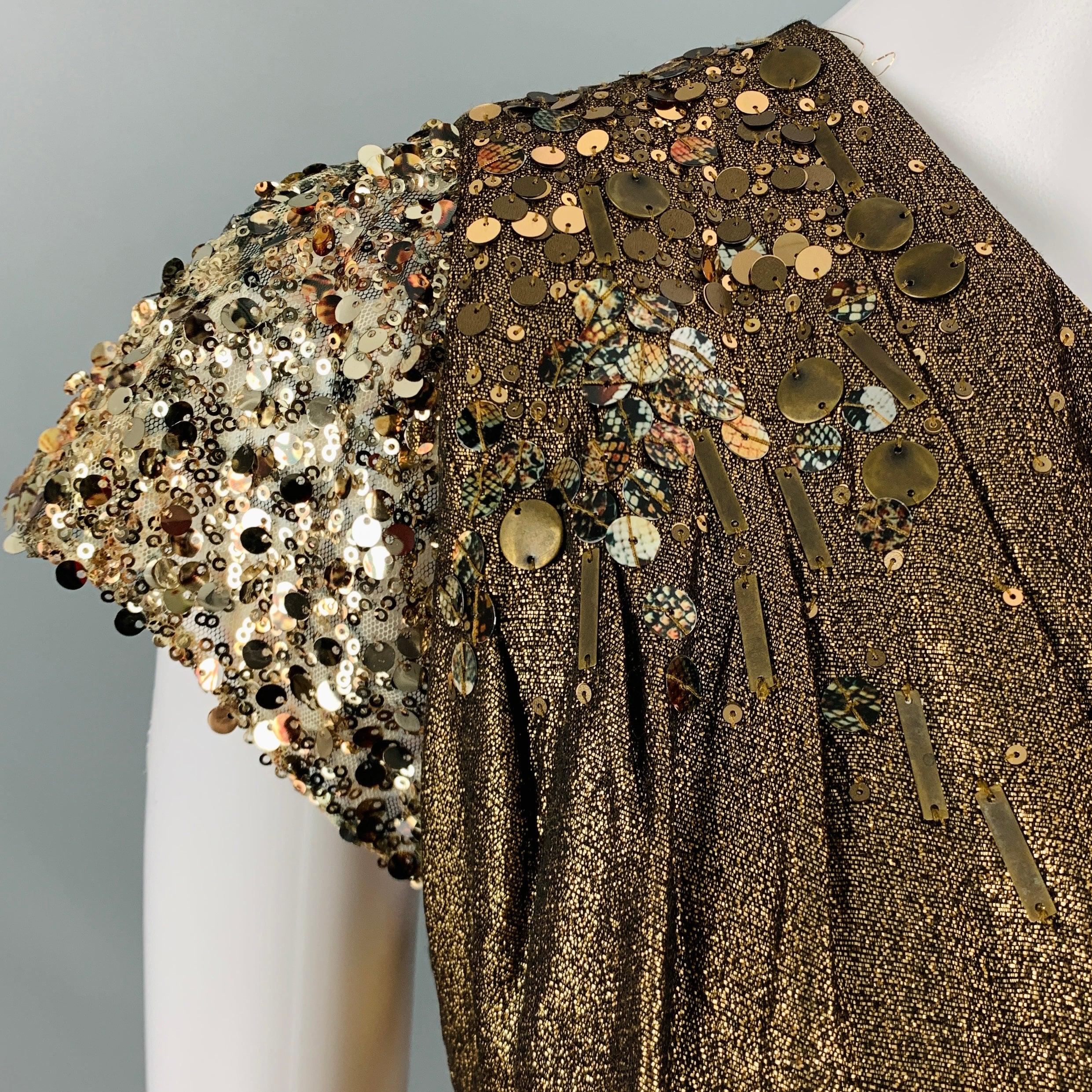 ELIE TAHARI dress
in a metallic gold cotton blend fabric featuring a one shoulder style with beaded and sequined cap sleeve, and side zipper closure. Very Good Pre-Owned Condition. Minor signs of wear. 

Marked:   IT 44 

Measurements: 
  Bust: 34