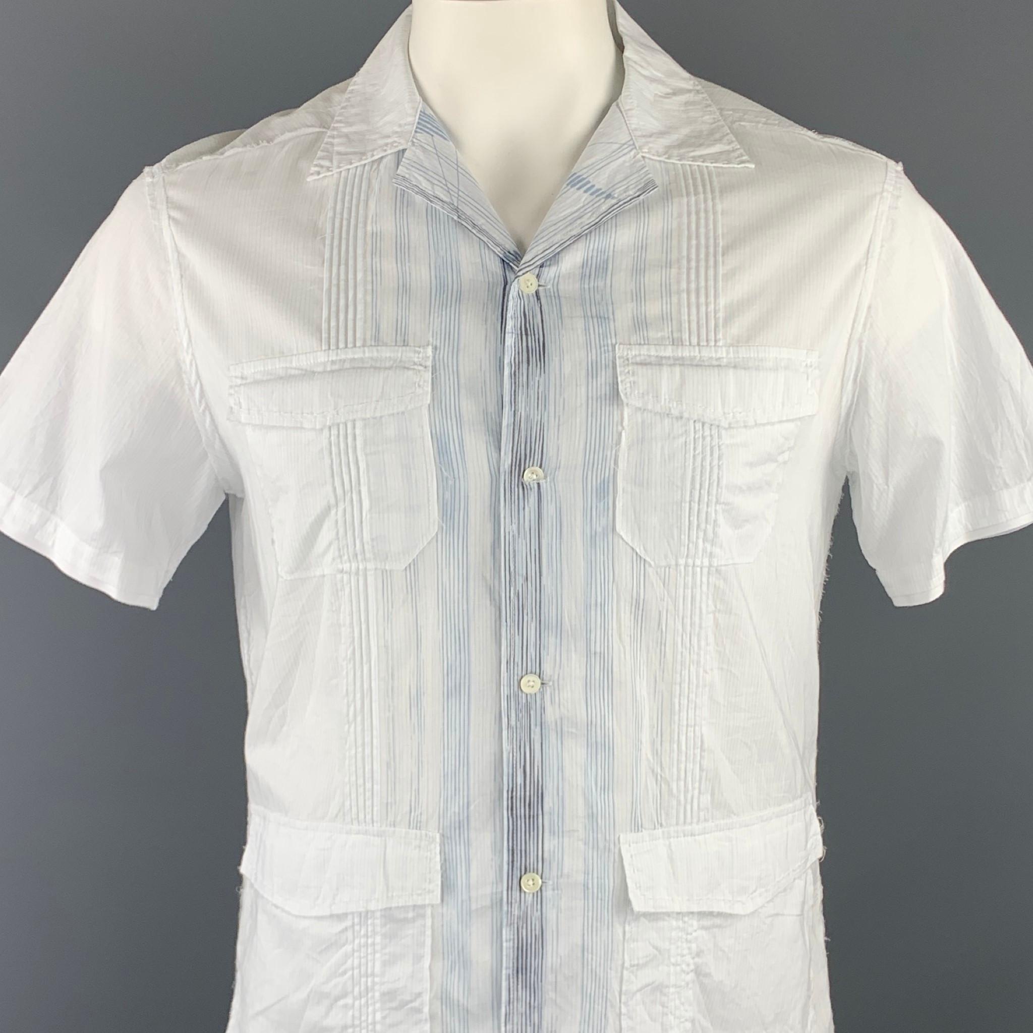 ELIE TAHARI short sleeve shirt comes in a white & blue pinstripe cotton featuring a button up style, patch pockets, contrast stitching, and a spread collar.

Excellent Pre-Owned Condition.
Marked: M

Measurements:

Shoulder: 17 in. 
Chest: 42 in.
