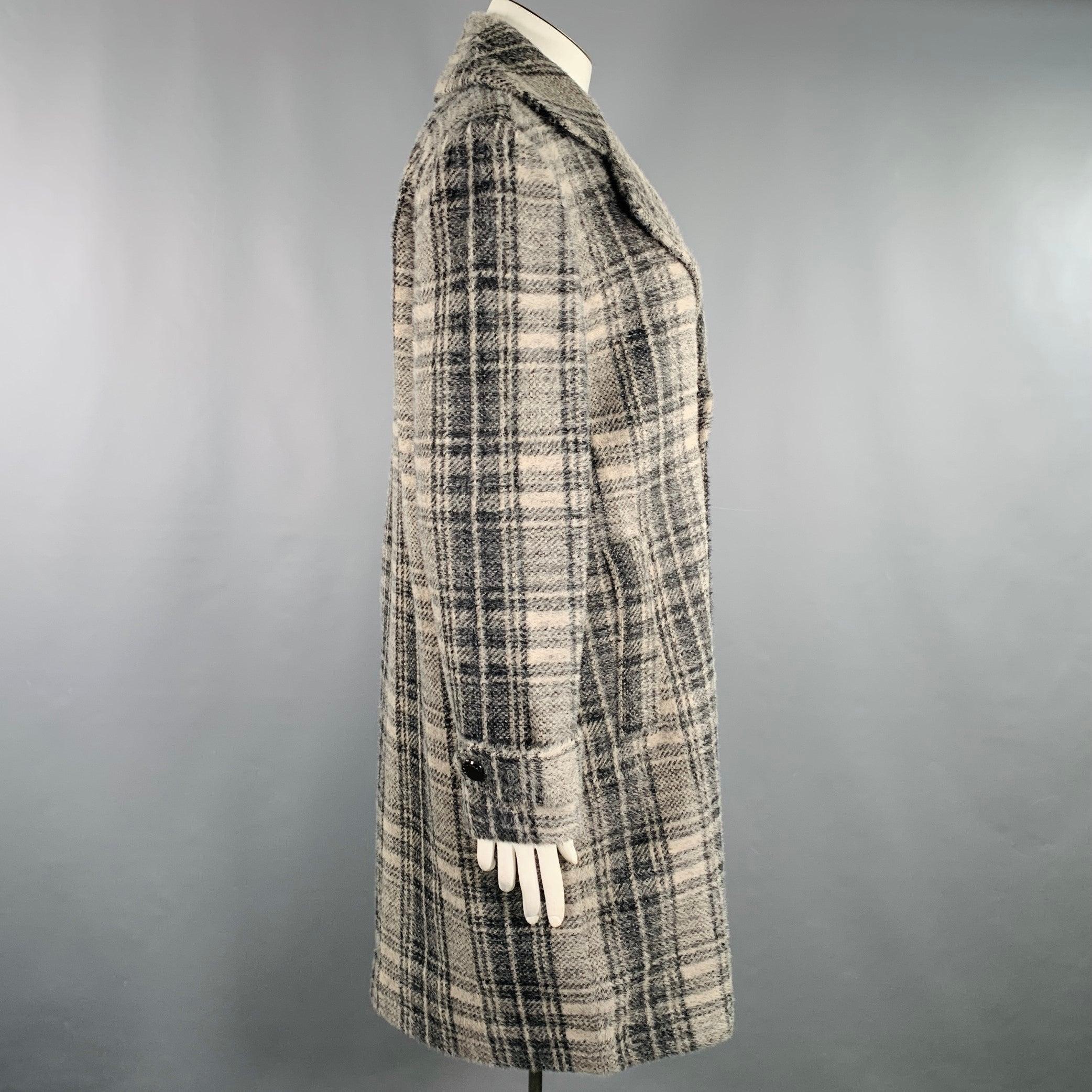 ELIE TAHARI coat
in a grey and black nylon blend featuring a double breasted style, plaid pattern, and double button closure.New with Tags. 

Marked:   XL 

Measurements: 
 
Shoulder: 19.5 inches Bust: 49 inches Sleeve: 25 inches Length: 39.5 inches