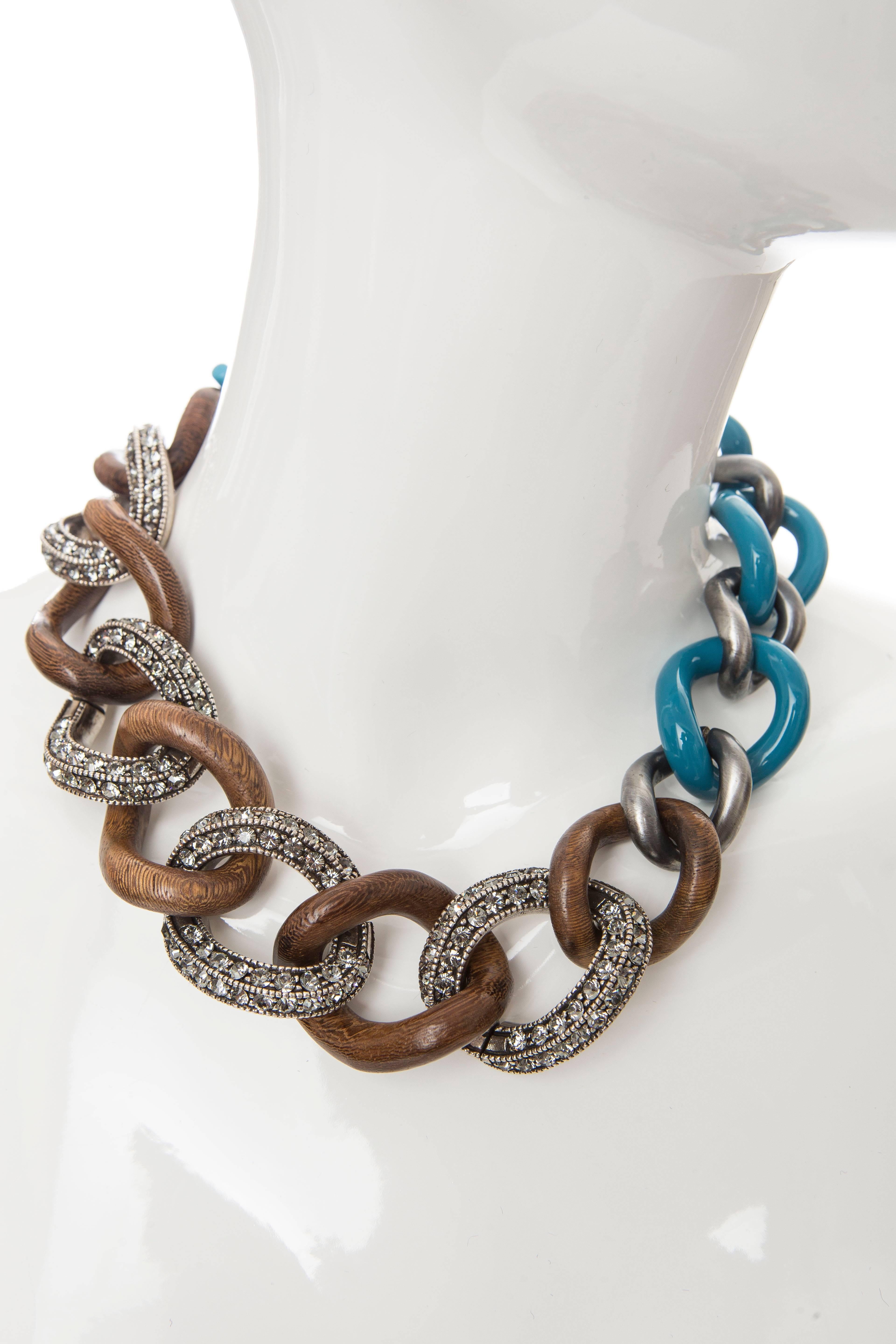 Gunmetal, wood and blue enamel Lanvin chain-link necklace with crystal embellishments and toggle closure.
Chain Length 11