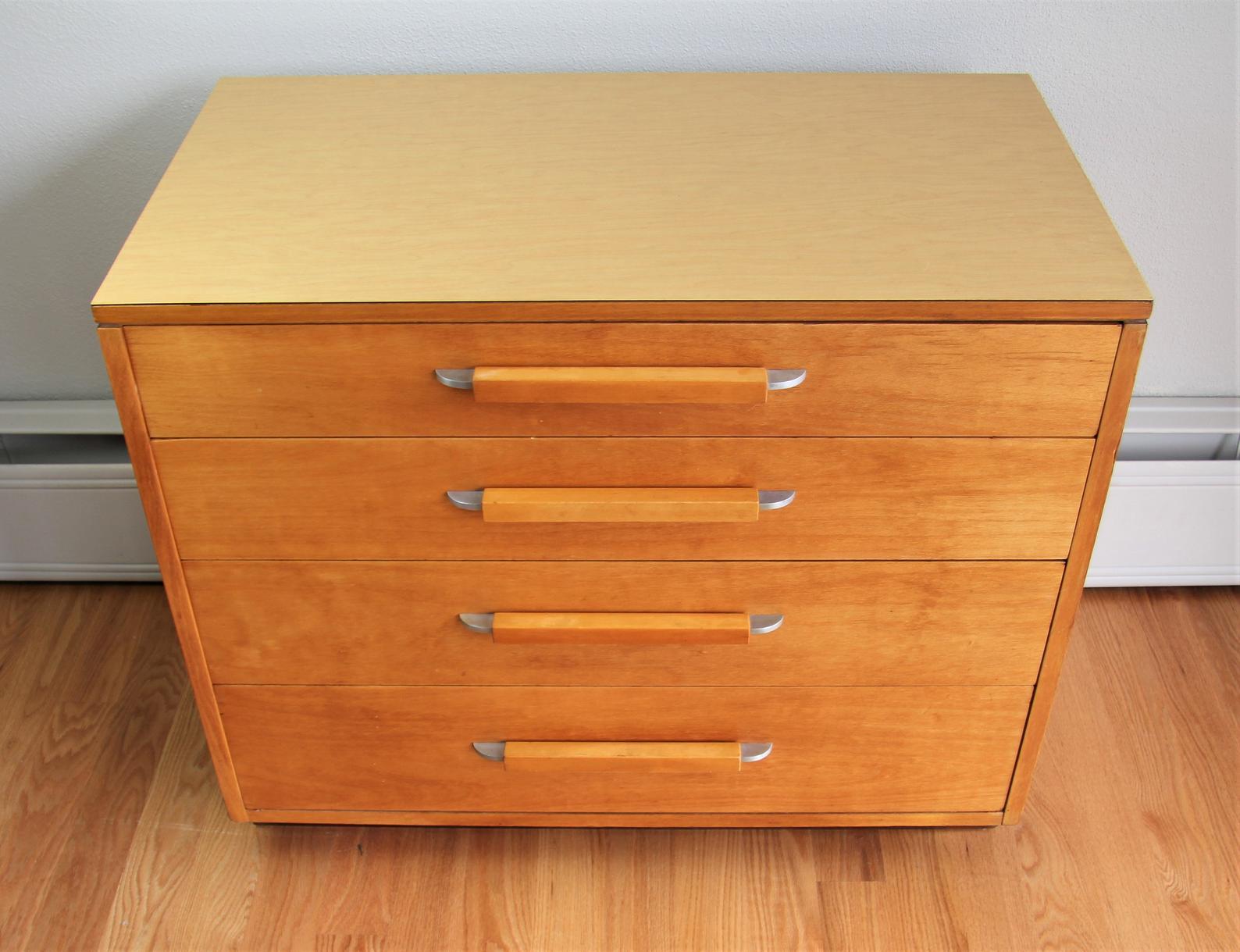 Eliel Saarinen short four drawer dresser for Johnson Furniture Co. The design is from the FHA (Flexible Home Arrangement) a modular collection by Eliel Saarinen. However, these pieces are by John Stuart, perhaps in collaboration with the