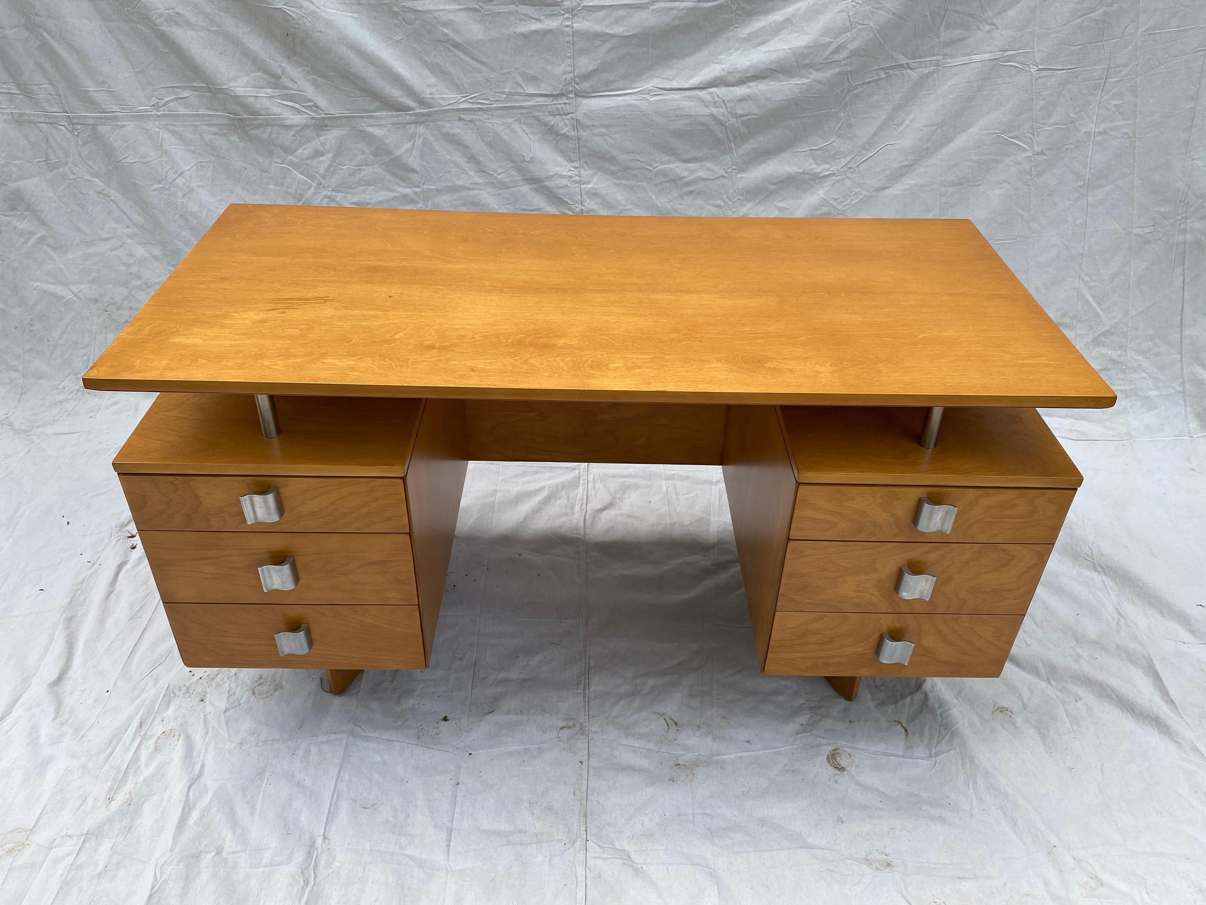 Eliel Saarinen for Johnson Furniture company birch desk, beautifully refinished in it's original color. Saarinen designed a complete series for the company. This being the absolute show stopper! Curved base matches the curved handles. Floating top