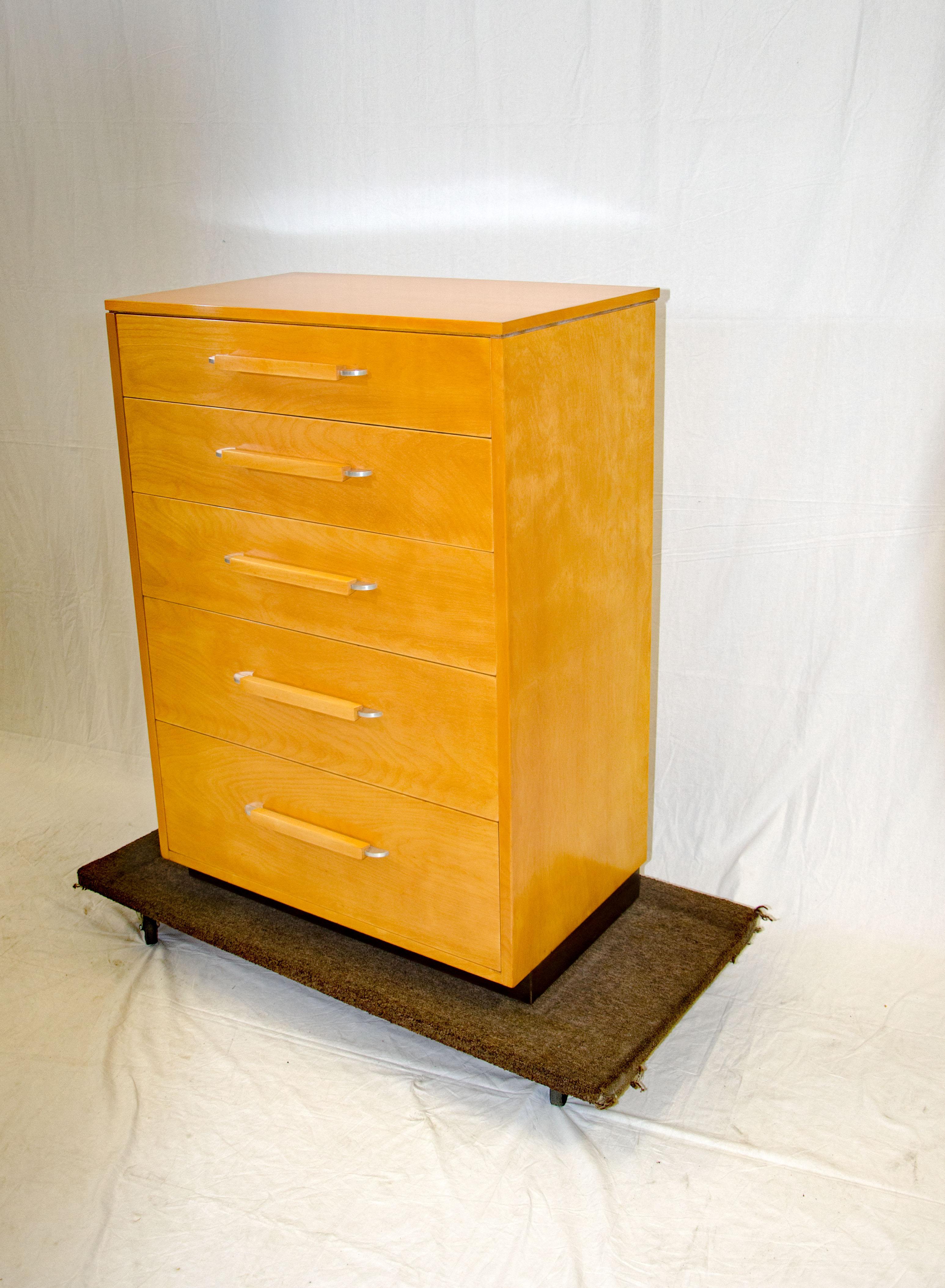This highboy dresser design is from the FHA (Flexible Home Arrangement) collection by Eliel Saarinen, in collaboration with Eva-Lisa (Pipsan) Saarinen Swanson and J. Robert F. Swanson. The extended back edge of the top allows for snug placement