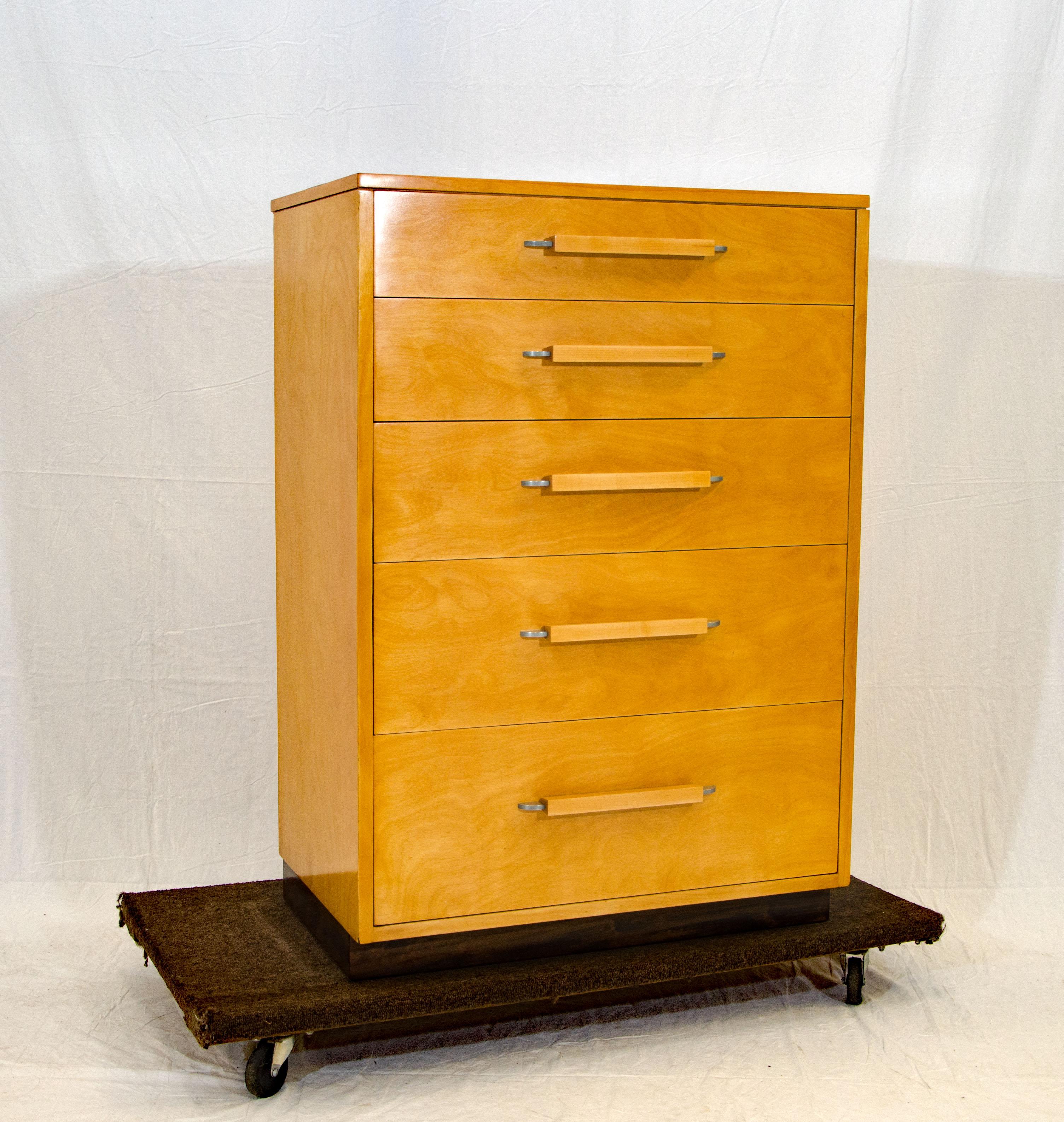 This highboy dresser design is from the FHA (Flexible Home Arrangement) collection by Eliel Saarinen, in collaboration with Eva-Lisa (Pipsan) Saarinen Swanson and J. Robert F. Swanson. The extended back edge of the top allows for snug placement