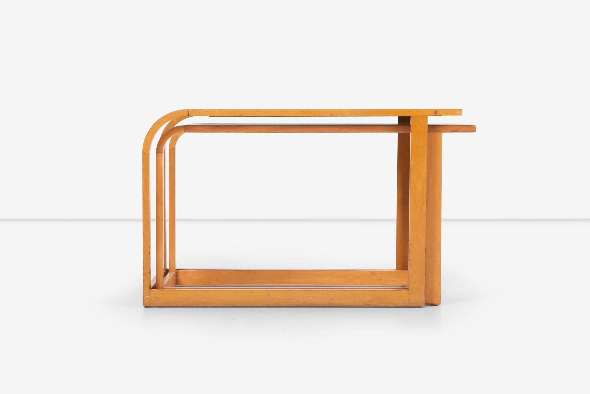 Eliel Saarinen nesting tables for Johnson Furniture Company 1940, Set of two Maple frames one top aluminum.
Dimensions for the two:


17½ H × 28 W × 18¼ D inches top table
16¼ H × 26 W × 15¼ D inches bottom table.