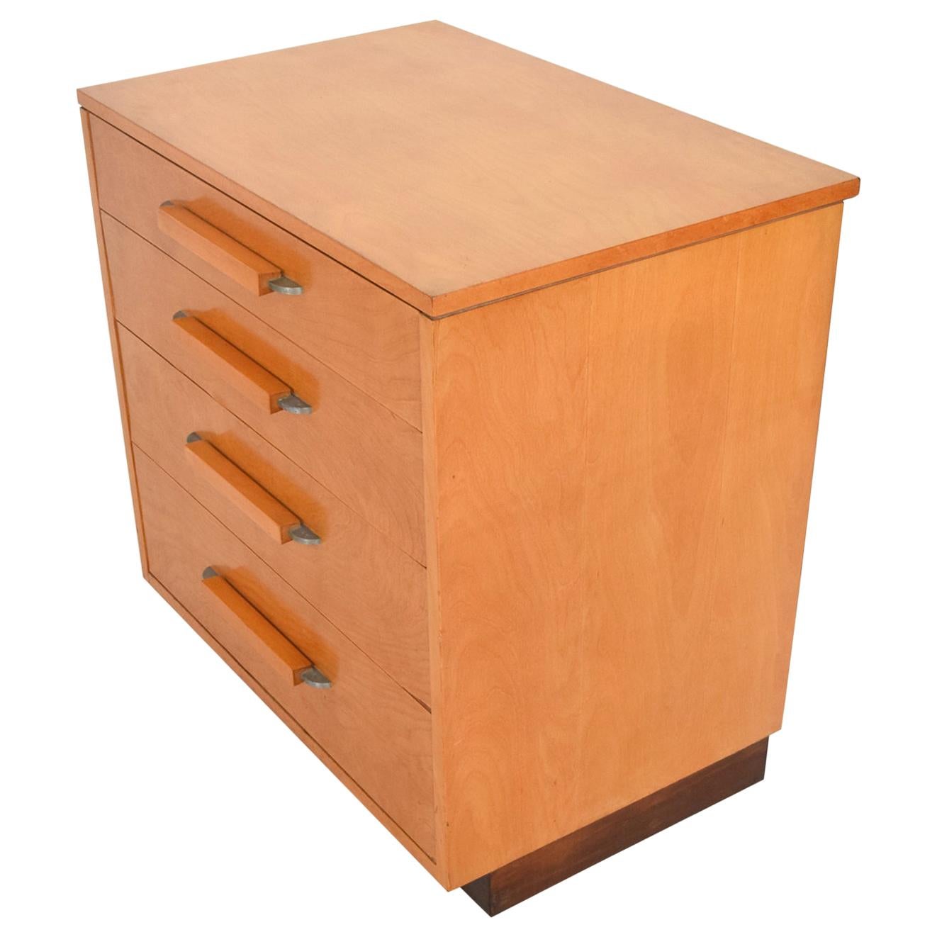 Art Deco Blonde Dresser by Eliel Saarinen 1940s Johnson Furniture Co.
Dresser for FHA collection by Eliel Saarinen. 
Short low compact design.
Birch oak wood contrasting mahogany dark base.
Sculptural art deco zinc aluminum pulls
Original Unrestored