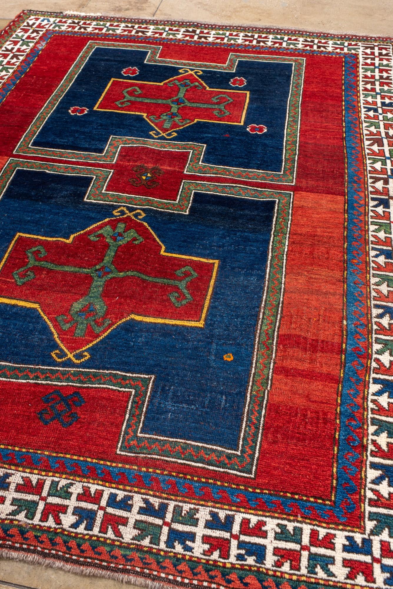 Caucasian Antique Kazak Rug with Rich Blue and Red Colors For Sale