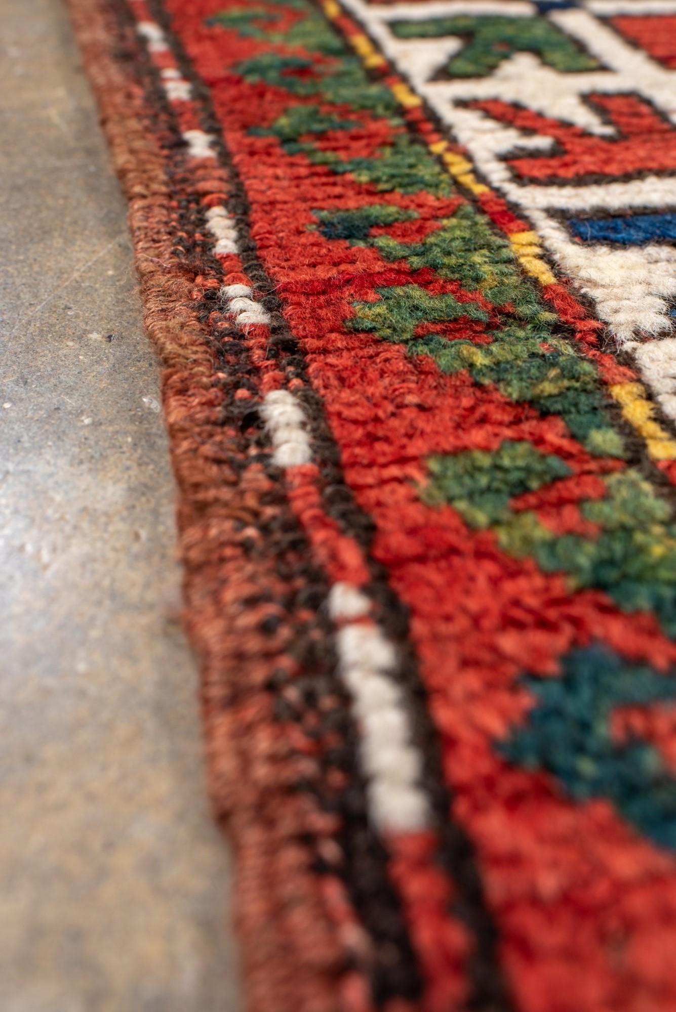 20th Century Antique Kazak Rug with Rich Blue and Red Colors For Sale