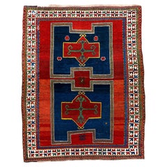 Antique Kazak Rug with Rich Blue and Red Colors