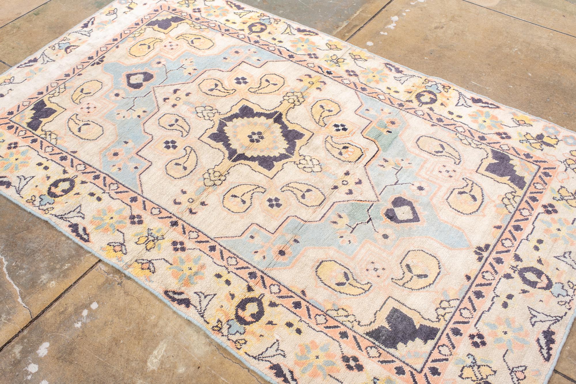 Wool Antique Cotton Agra Rug with Pale Blue Field For Sale