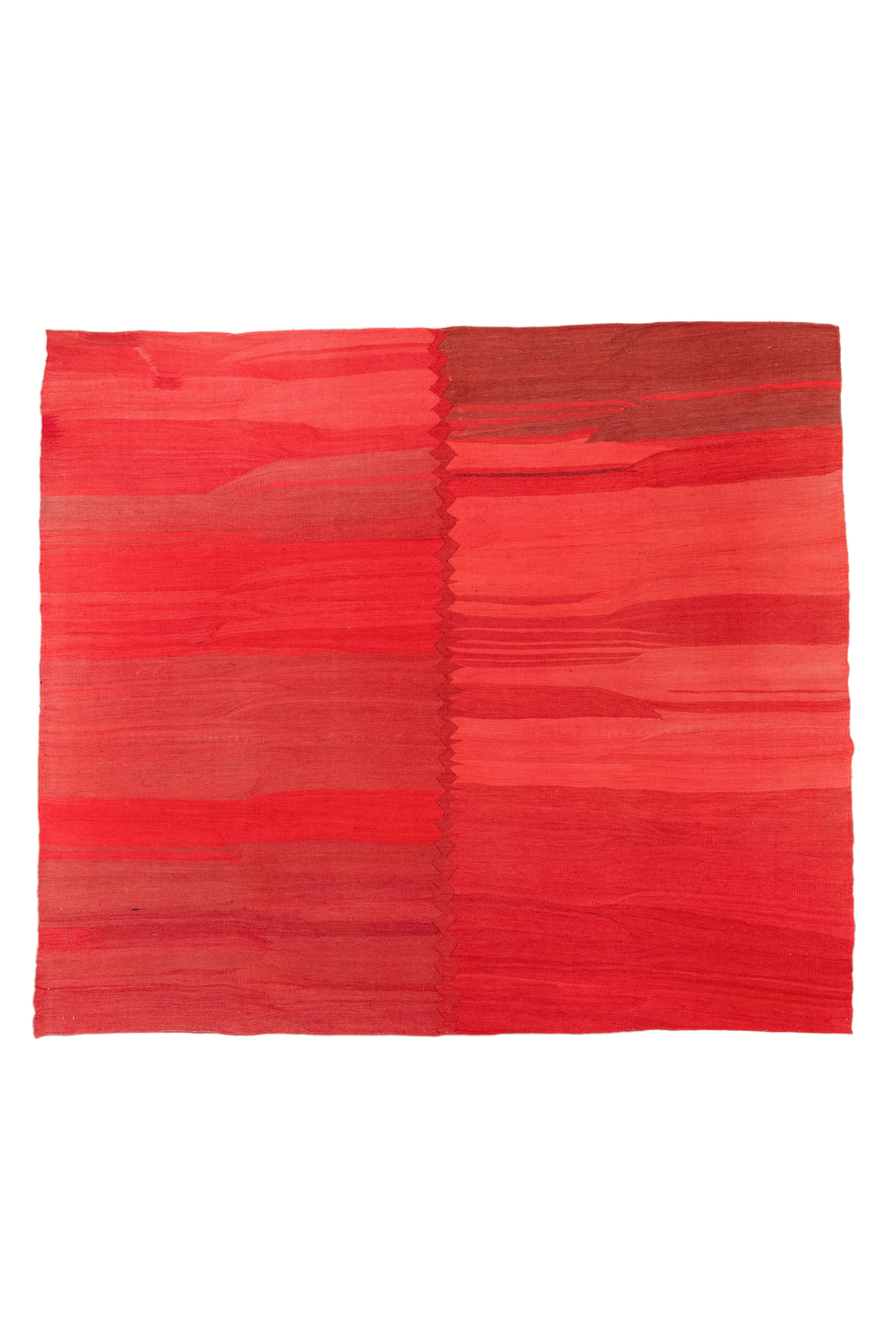 The fascinating shades of Desert Rose and Poppy are seen in an attractive monochrome design on this 8X9'6 Persian Kilim rug from 1940. The light shades, finely created with a hand-knotting technique, show a modern appeal, making it the ideal match