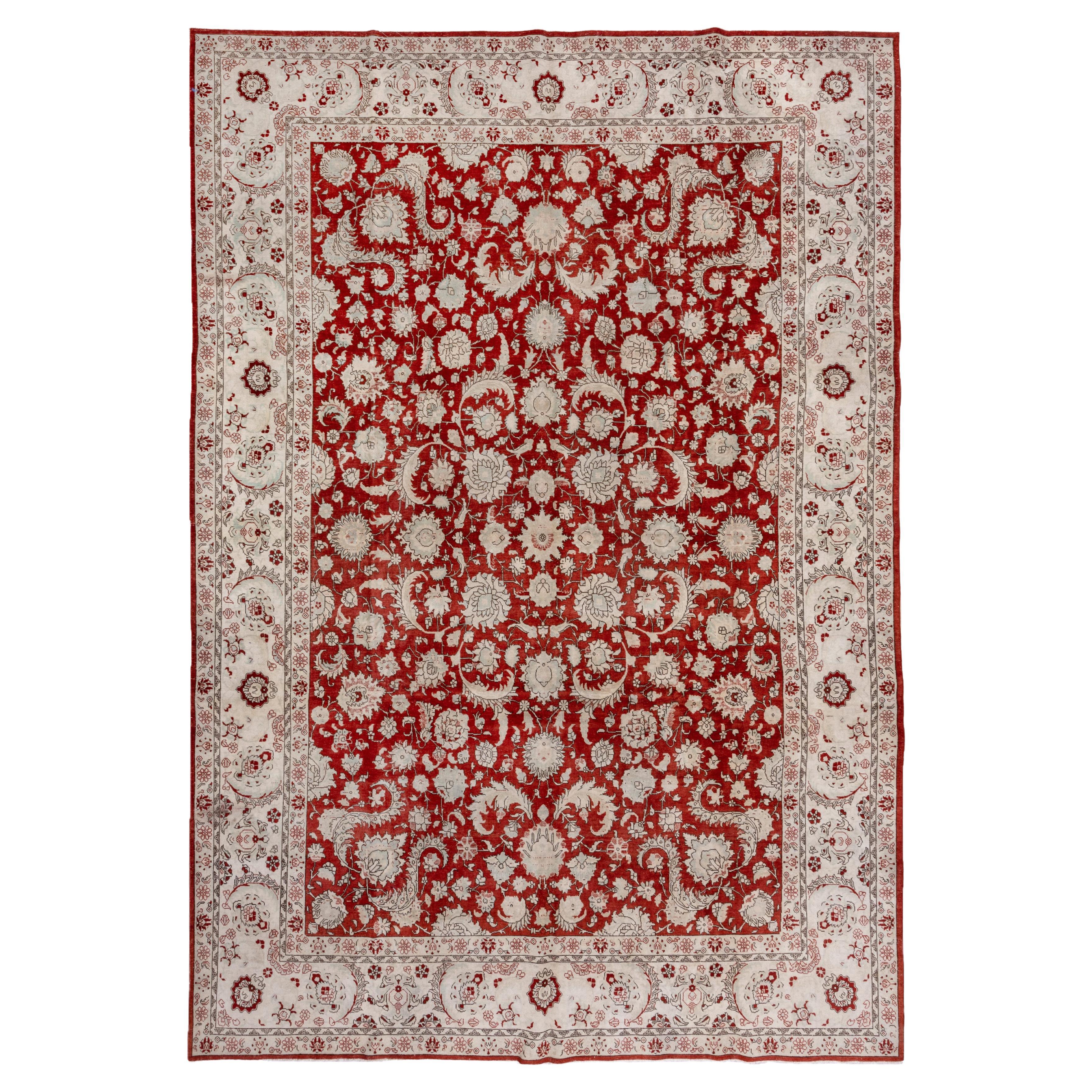 Antique Persian Tabriz Rug with a Red Allover Field