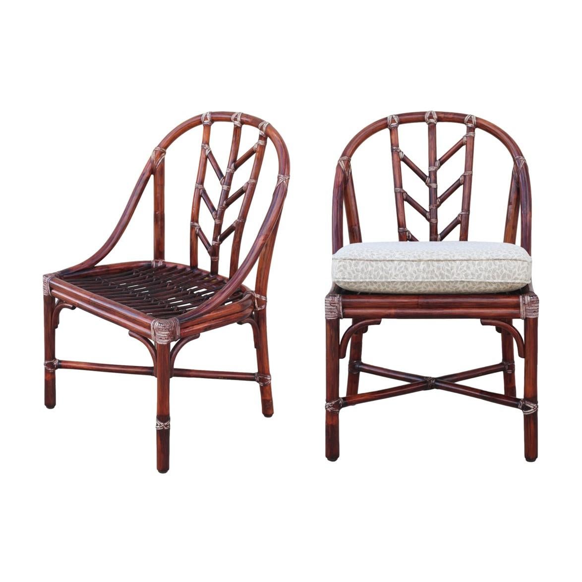 A beautiful pair of M-74 dining chairs designed by Elinor McGuire for McGuire San Francisco. Chairs have the original finish and feature McGuire’s signature woven rawhide bindings with an aged patina, a stick deck and generous seats. Chair splats