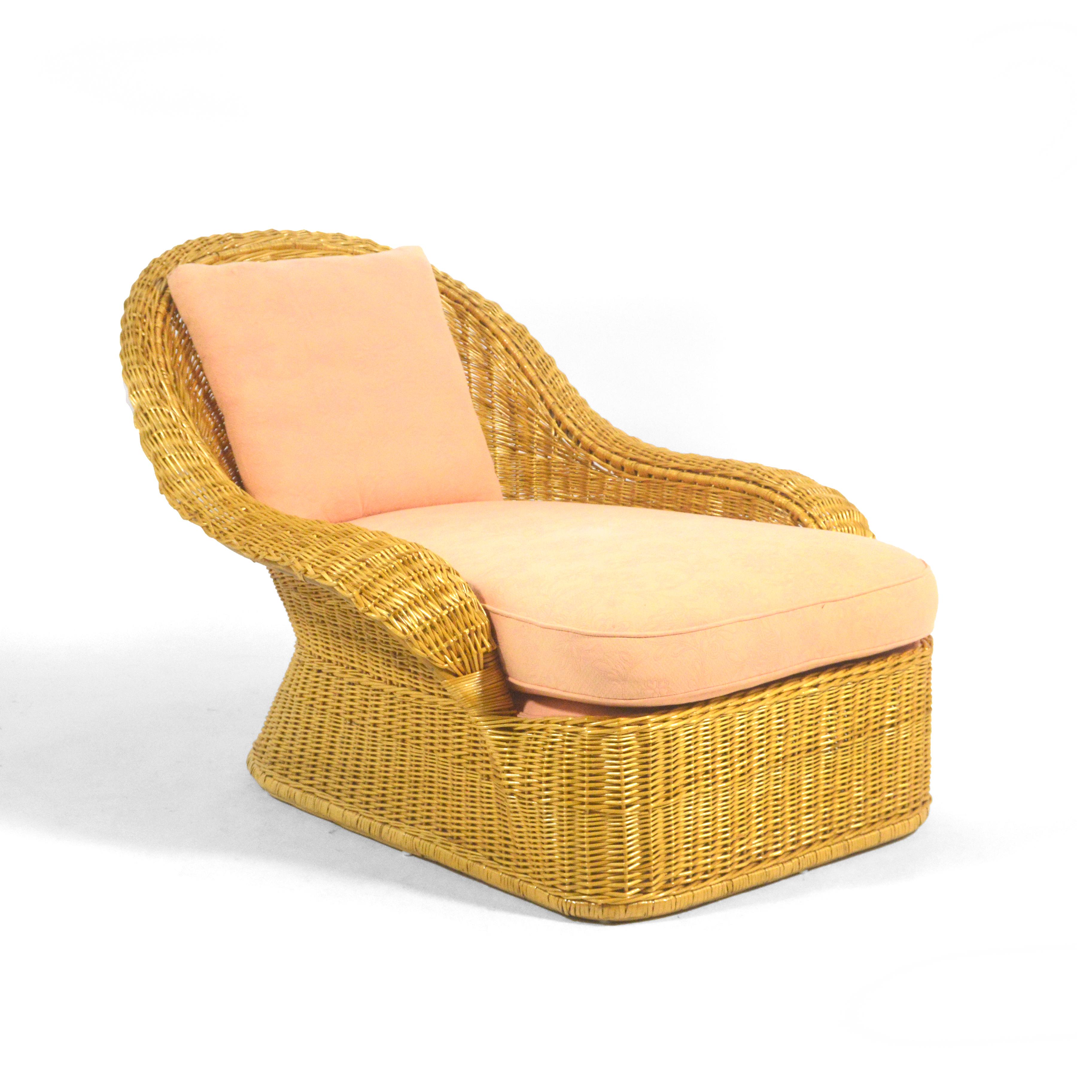 This large and dramatic Model RW-32X chaise by Elinor McGuire for McGuire of San Fransisco is as comfortable as it is a strong statement piece in any room. The undulating, organic form executed in rattan and wicker is a staggeringly sexy, sculptural