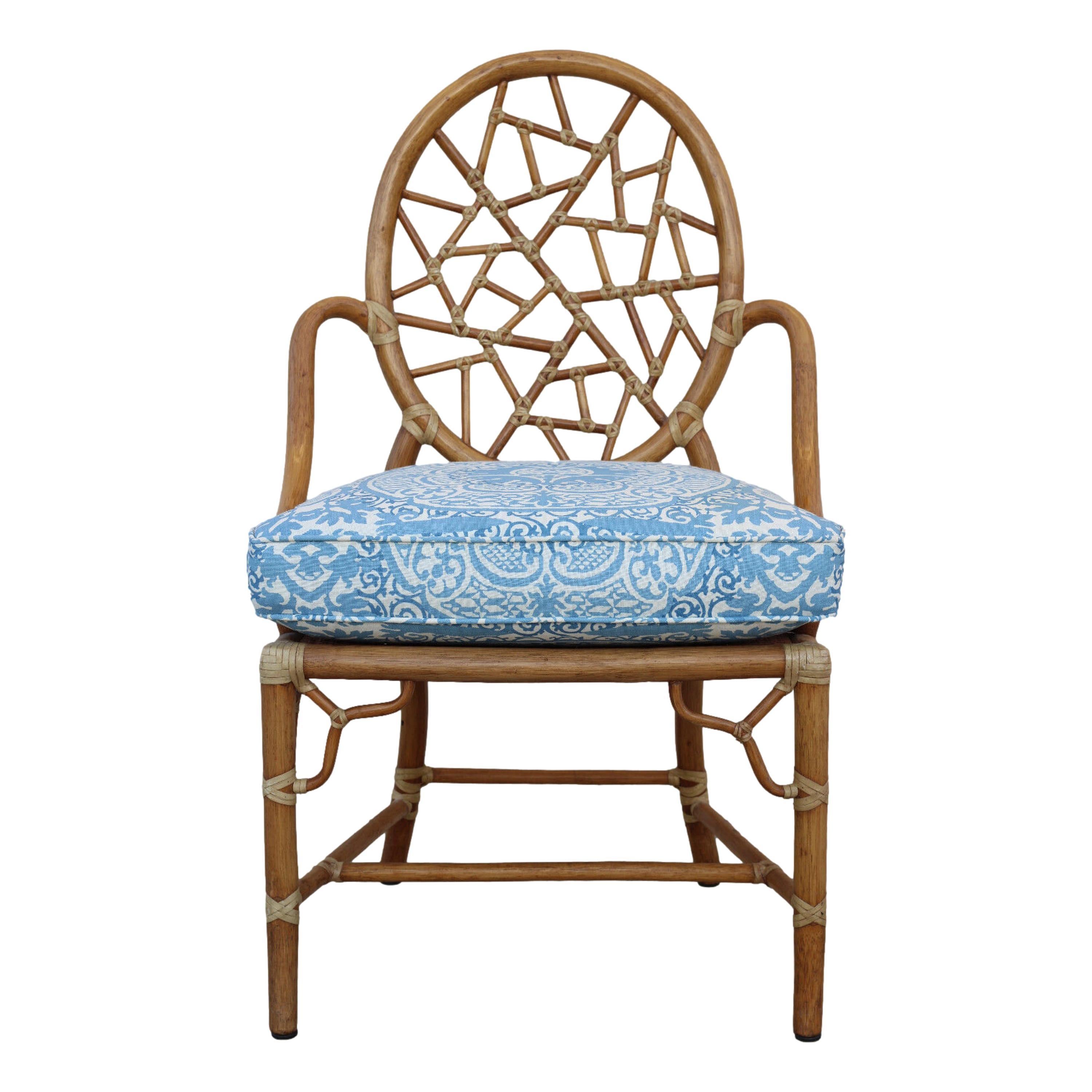 Gorgeous set of six iconic rattan Cracked Ice Chairs designed by breakthrough innovator Elinor McGuire. The design is famous for its rattan oval back that frames smaller rattan pieces bound by rawhide, creating the impression of cracked ice or