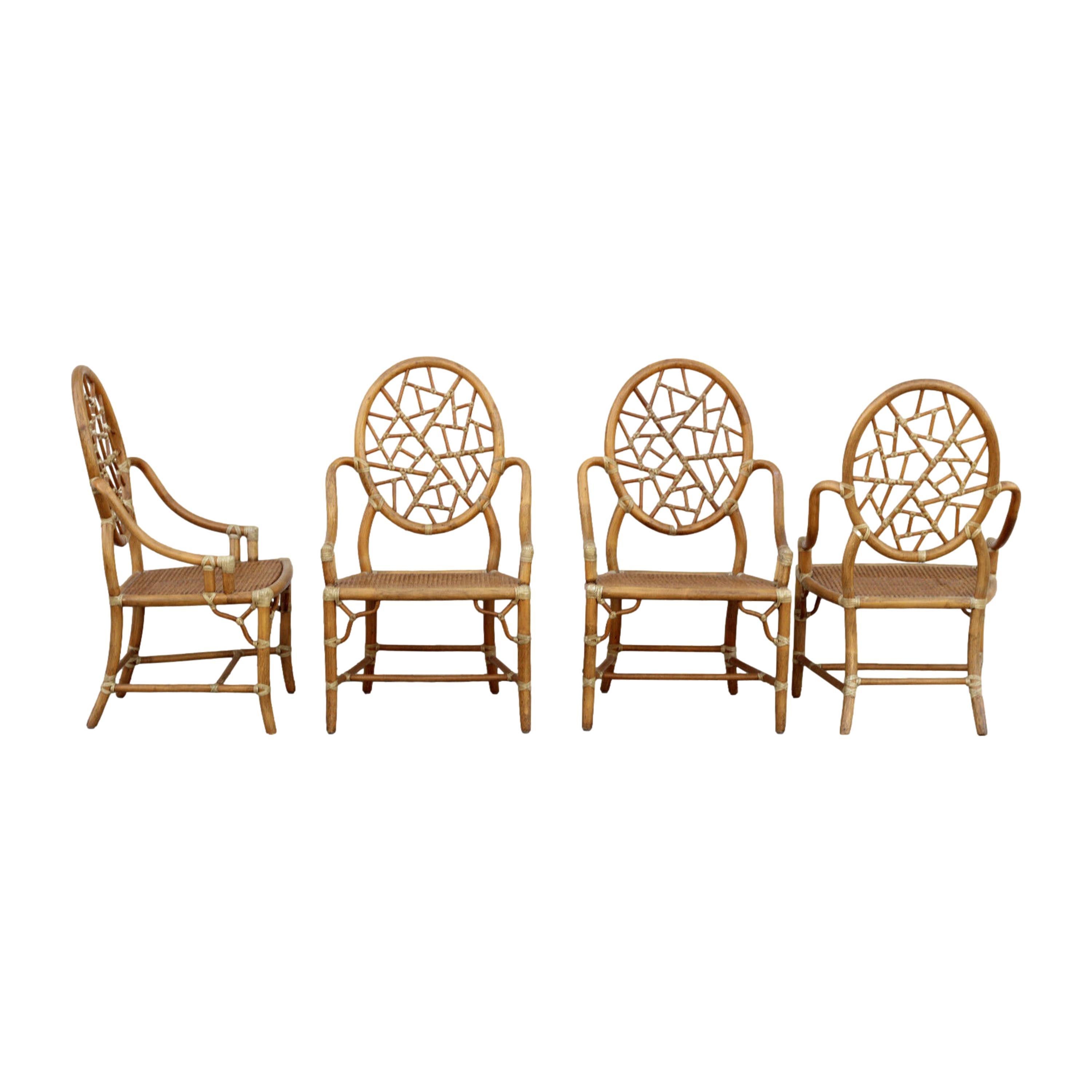 Set of four iconic cracked ice chairs designed by breakthrough innovator Elinor McGuire in 1968. The design is famous for its rattan oval back that frames smaller rattan pieces bound by rawhide, creating the impression of cracked ice or shattered