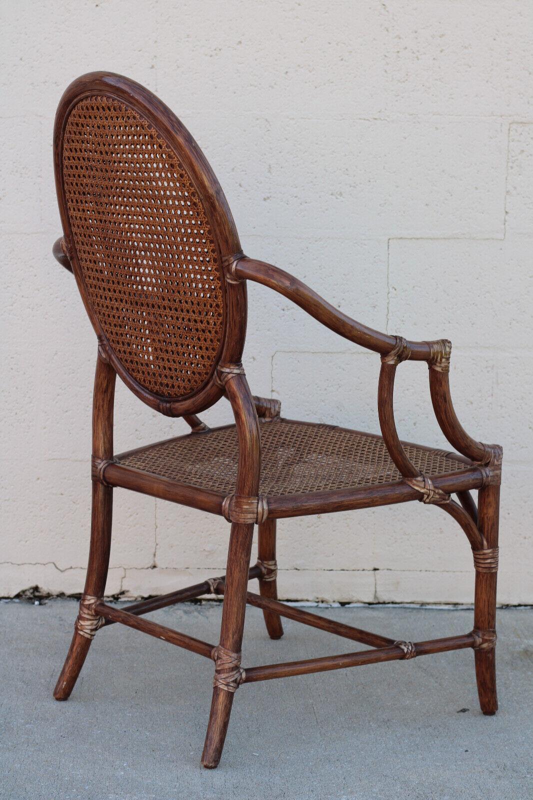 Hand-Crafted Elinor McGuire Rattan Cane Oval Back Dining Arm Chairs, a Set of Four For Sale