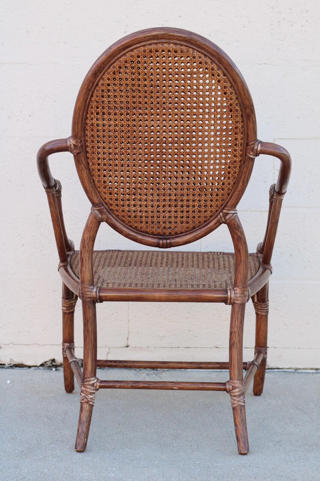 Elinor McGuire Rattan Cane Oval Back Dining Arm Chairs, a Set of Four In Good Condition For Sale In Vero Beach, FL
