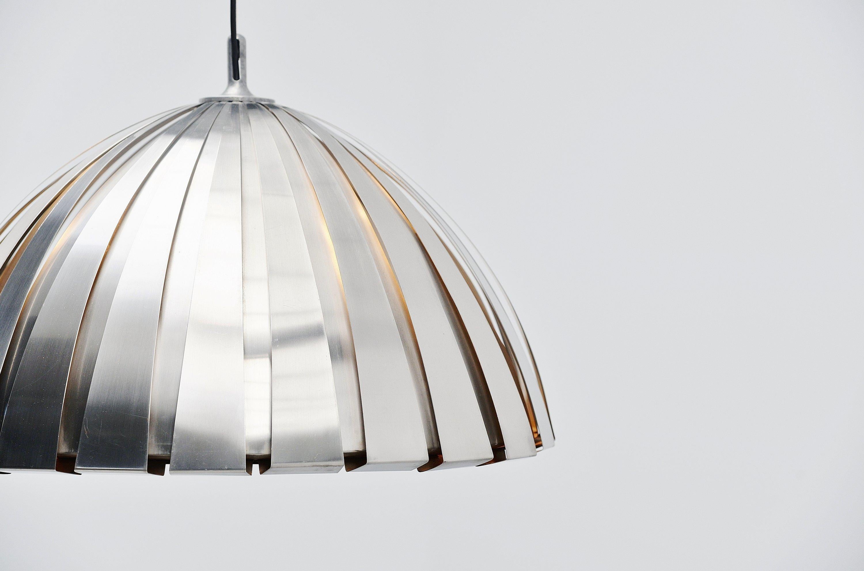 Fantastic shaped so called 'Calotta' model 1749 chandelier designed by Elio Martinelli and manufactured by Martinelli Luce, Italy, 1960. The lamp is made of several layers of stainless steel and gives very nice light when lit because of the multiple
