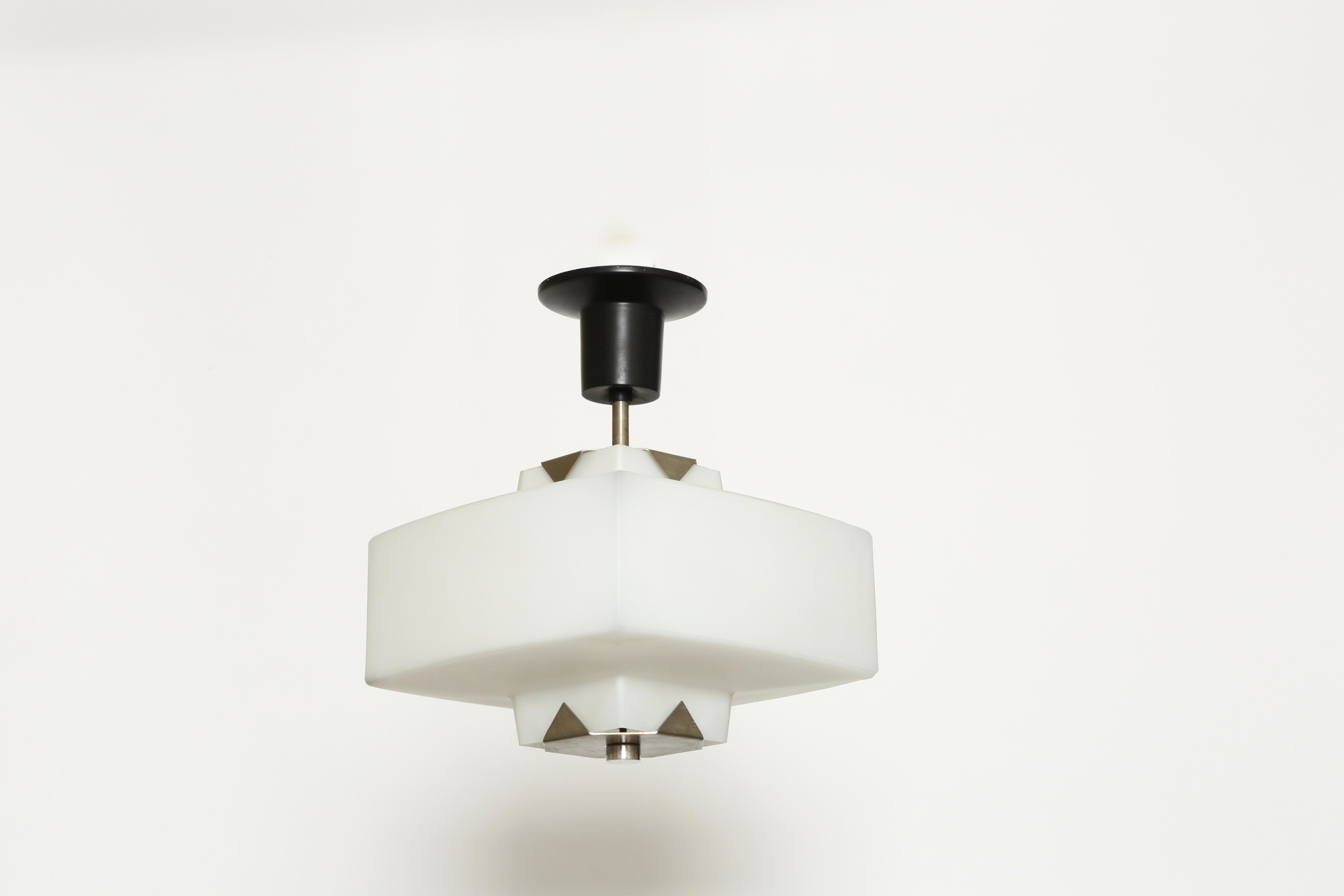 Elio Monesi from Arredoluce ceiling pendant.
Very rare ceiling light.
Italy, 1960s
Nickeled metal, duplex white opal glass.
Literature: Arredoluce. Catalogue Raisonne, Page 330.