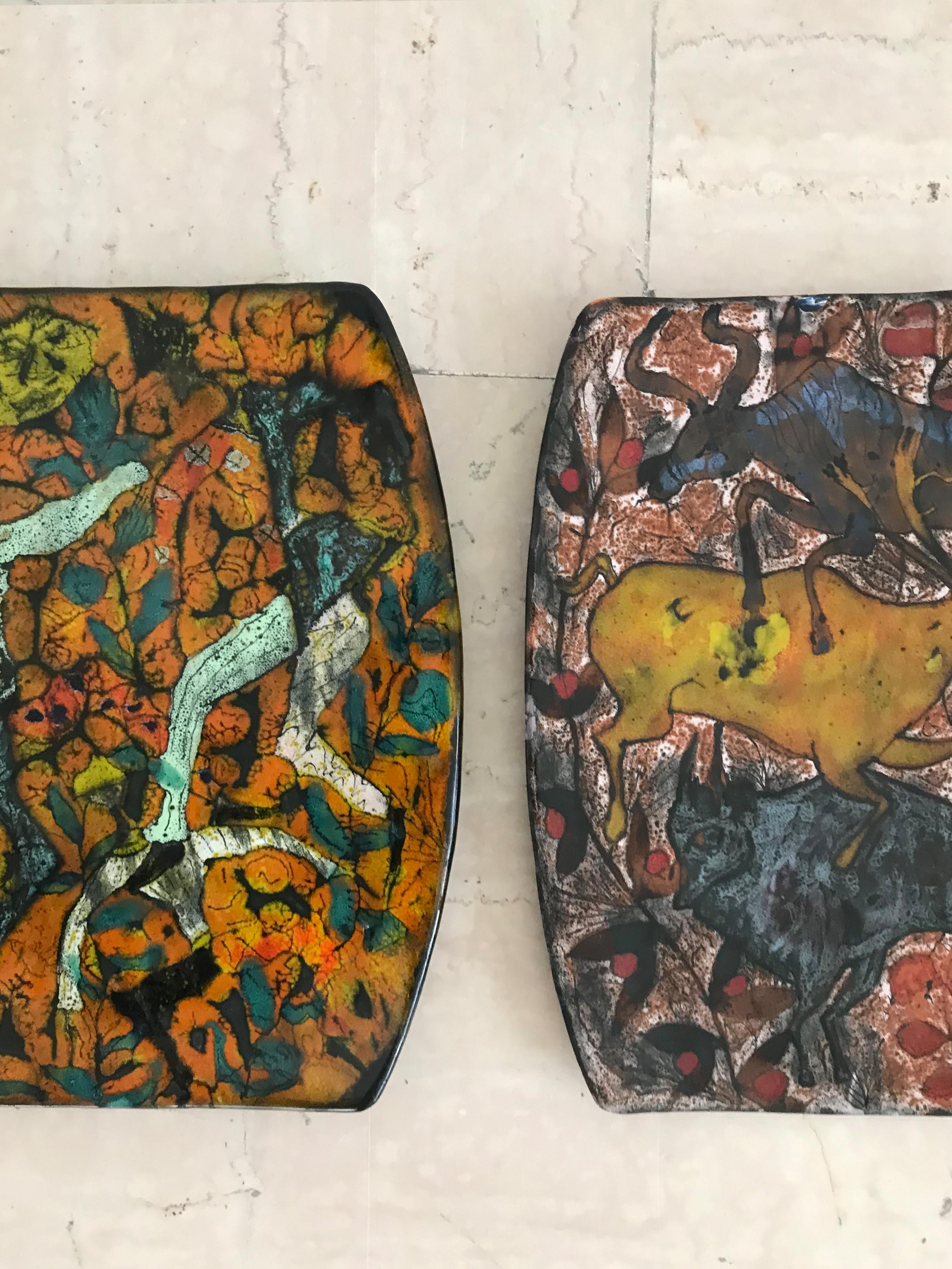 Pair of Italian ceramic wall tile plates designed by Italian artist Elio Schiavon Venezia with graffito decoration depicting figures and animals, mark engraved on both backs of tiles, Italy 1960s.

The ceramic tiles are original to the period and