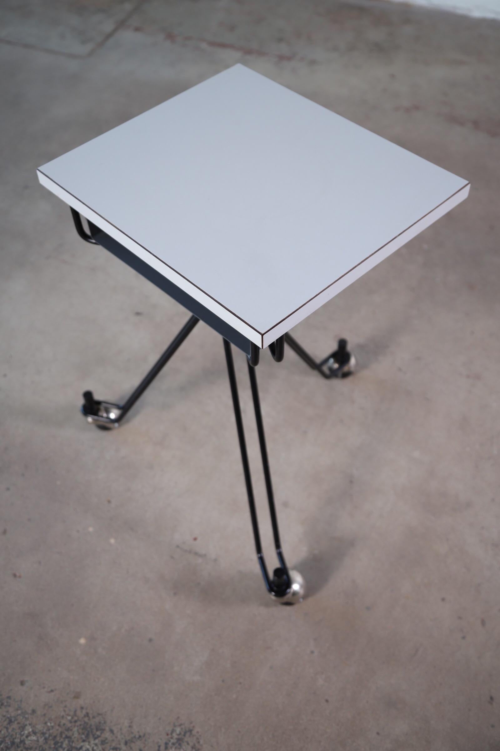 The three legged typewriter table by Eliot Noyes for IBM. A super utilitarian table on wheels. If you use a Macbook or any laptop computer, this sleek design makes for the best little work table while on the sofa. The three leg design makes for easy