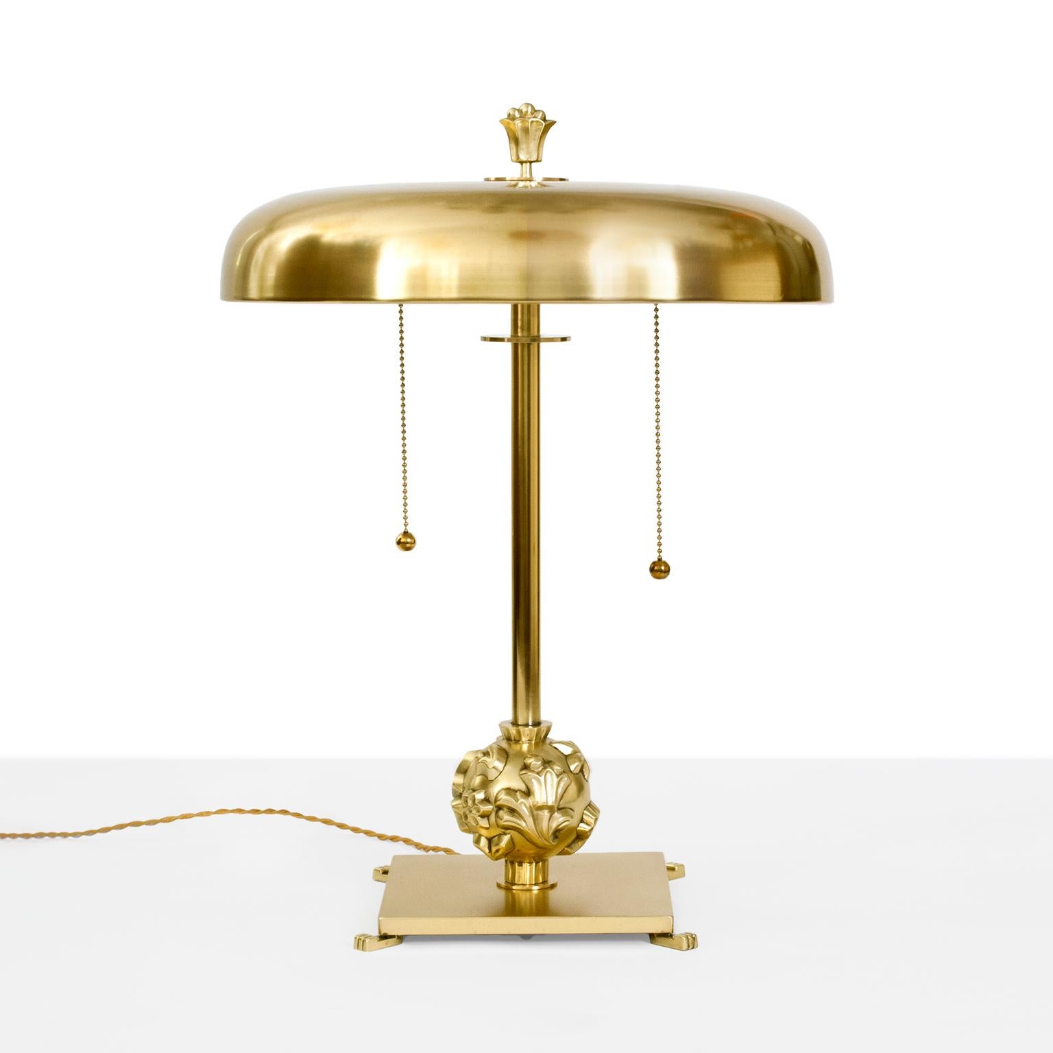 Scandinavian Modernh Art Deco polished brass table lamp designed by Elis Bergh, circa 1930 for Kosta. Bergh is known for his modernist designs which often referenced classicism. This lamp has been newly polished and lacquered with new wiring and has