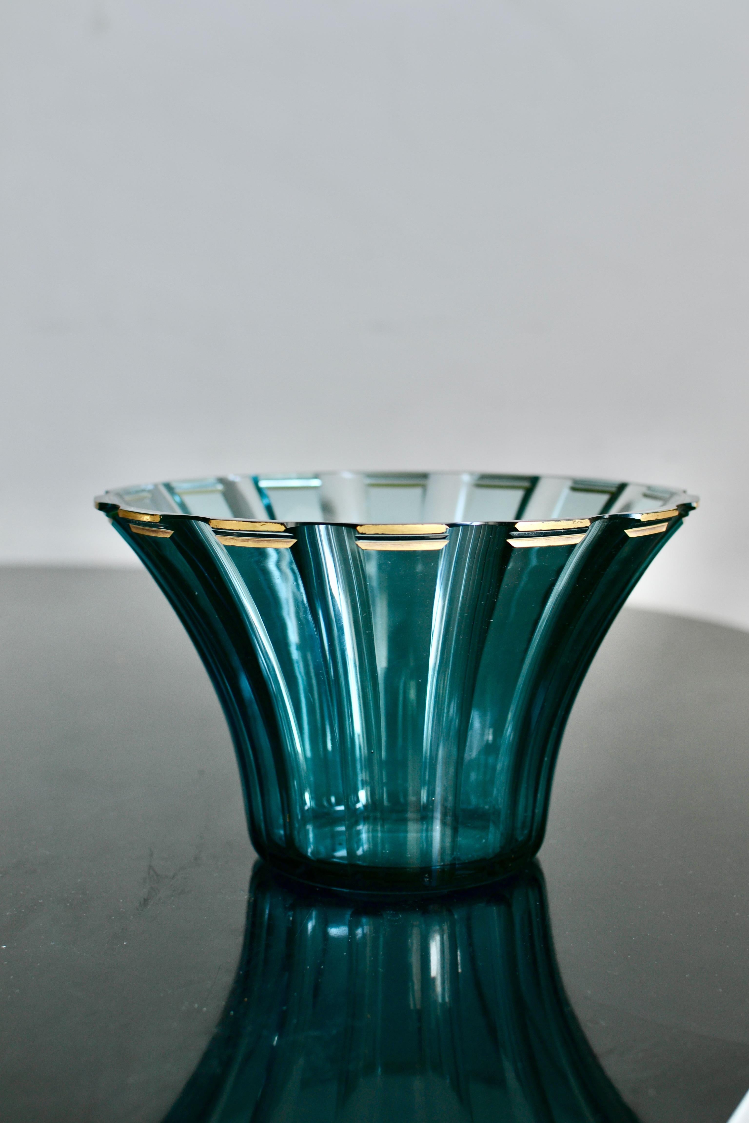 A very nice late 1920´s bluetoned glass bowl by Kosta after a design by Elis Bergh (1881-1954) Signed B305 Kosta on the bottom. Very nice condition. 

Elis Bergh, was an architect and designer, best remembered for his glass art and fixtures. His