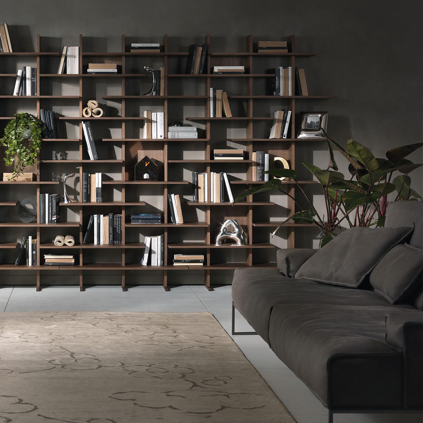 Designed by Cesare Arosio and Beatrice Fanchini, this modular, two-sided bookcase is an elegant addition to a contemporary living or study space. It features a clean yet sculptural contemporary design, handcrafted from Canaletto walnut or