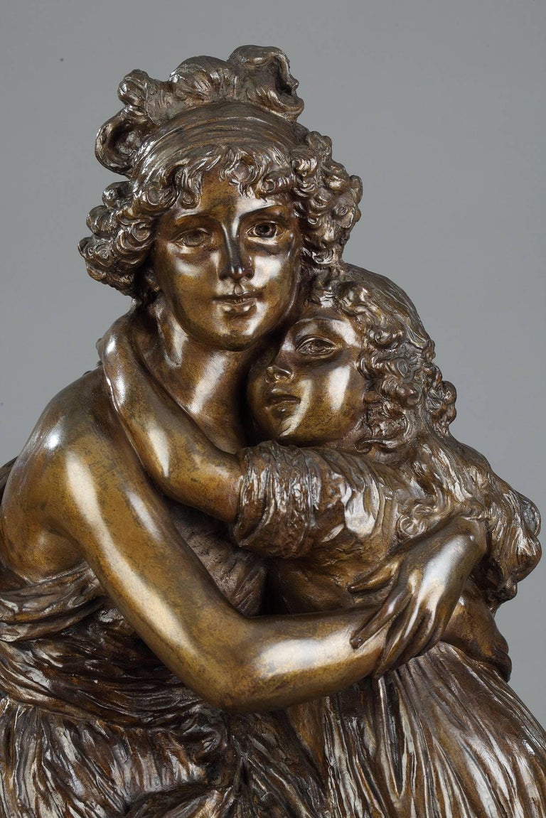 19th century bronze group with brown patina after the self-portrait with her daughter, Jeanne-Lucie-Louise called Julie, realized by Élisabeth Vigée Le Brun in 1789. The group is set on a red marble base. Titled on the base. The 1789 painting: Madam