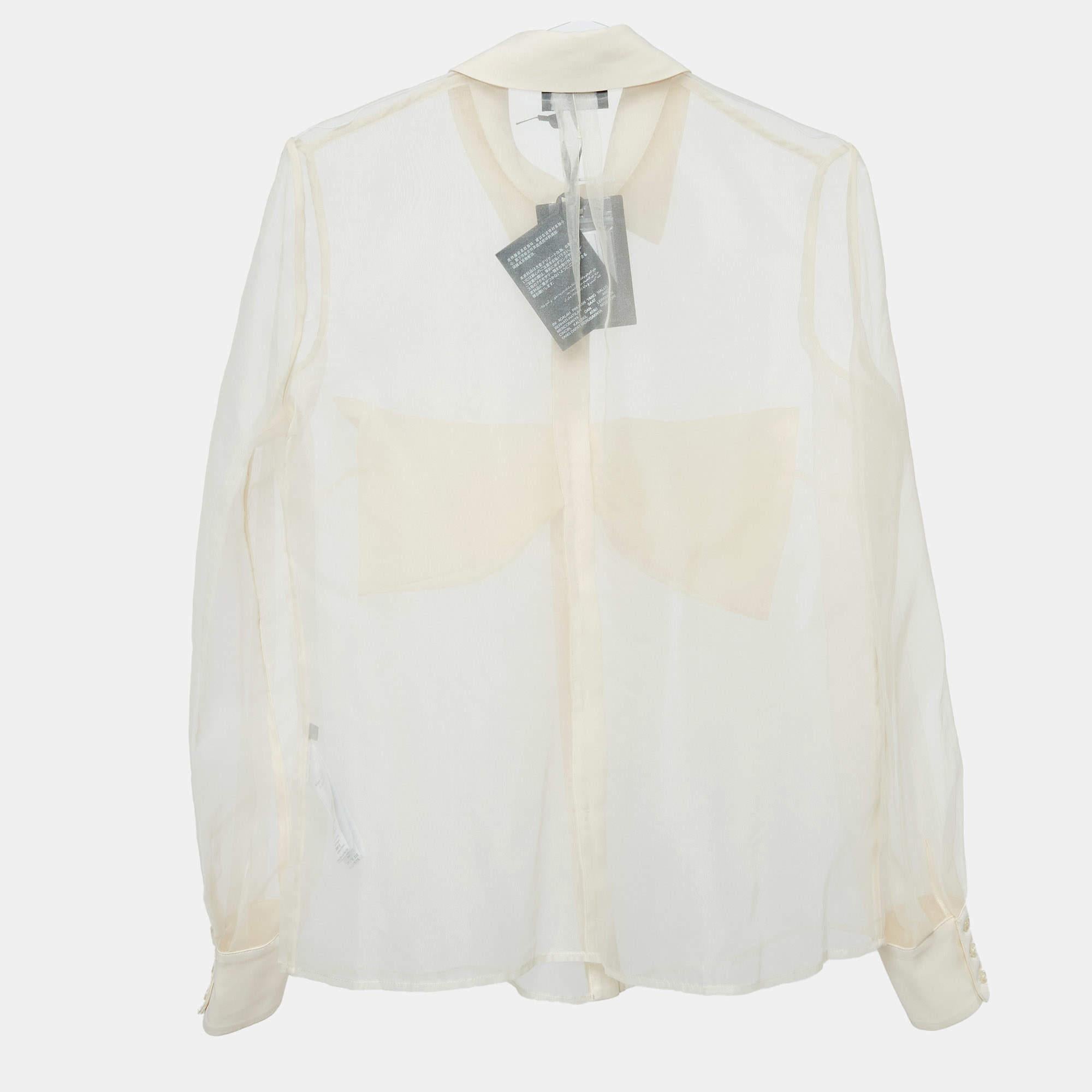 Elevate your style with the Elisabetta Franchi shirt. This elegant piece features a delicate sheer organza fabric with a charming bow detail at the neckline. Its light airy texture and sophisticated design offer a refined touch to any outfit perfect