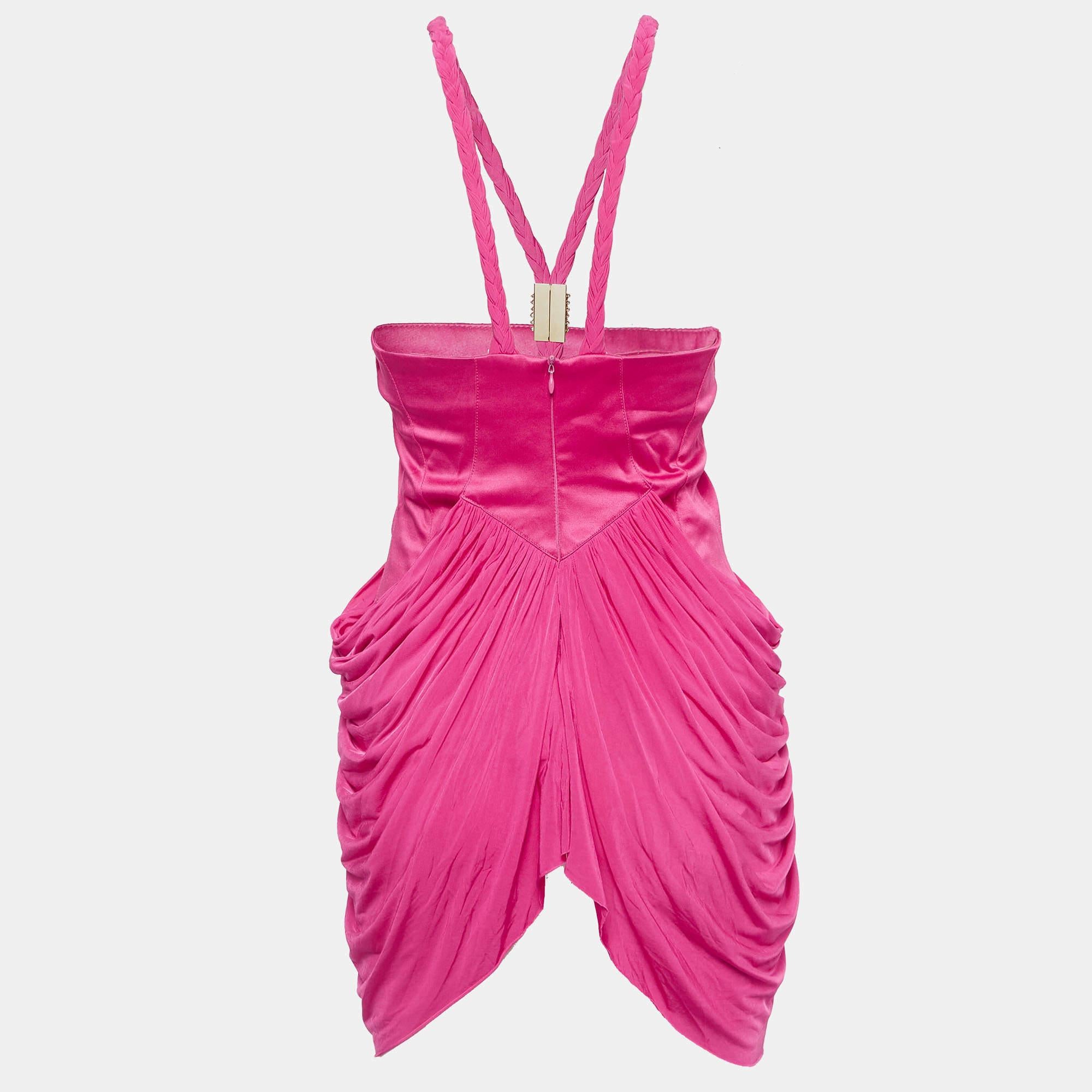 Crafted from luxurious stretch crepe it boasts a striking fuchsia hue. The metal detail at the neckline adds a touch of sophistication while the gathered design offers a flattering silhouette perfect for any occasion.
