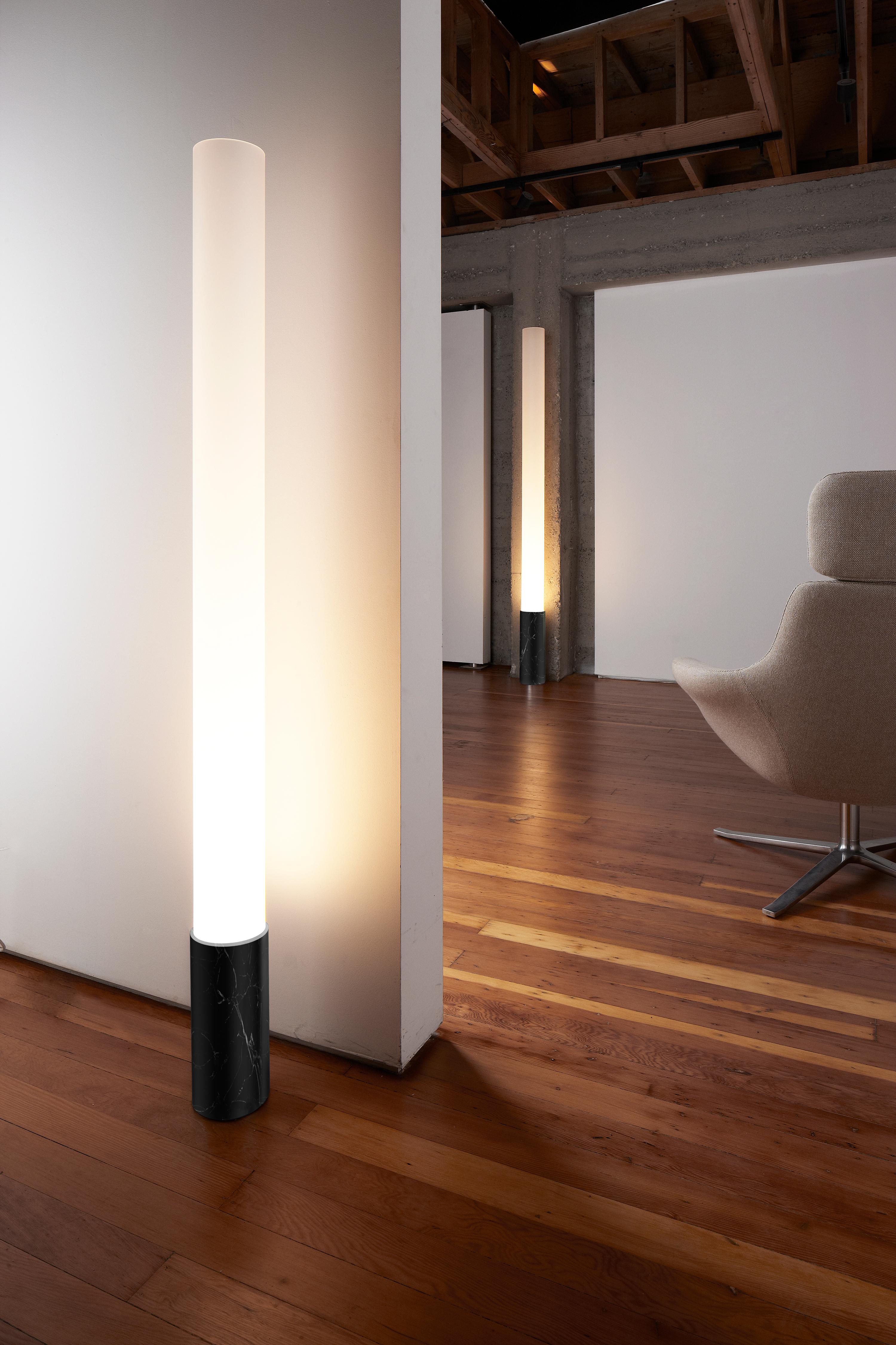 The timeless Elise lamp pays tribute to the advent of the machine age. Its refined machined marble base, combined with its towering frosted acrylic diffuser serves as the perfect combination for elegant lighting. Elise features full-range dimming