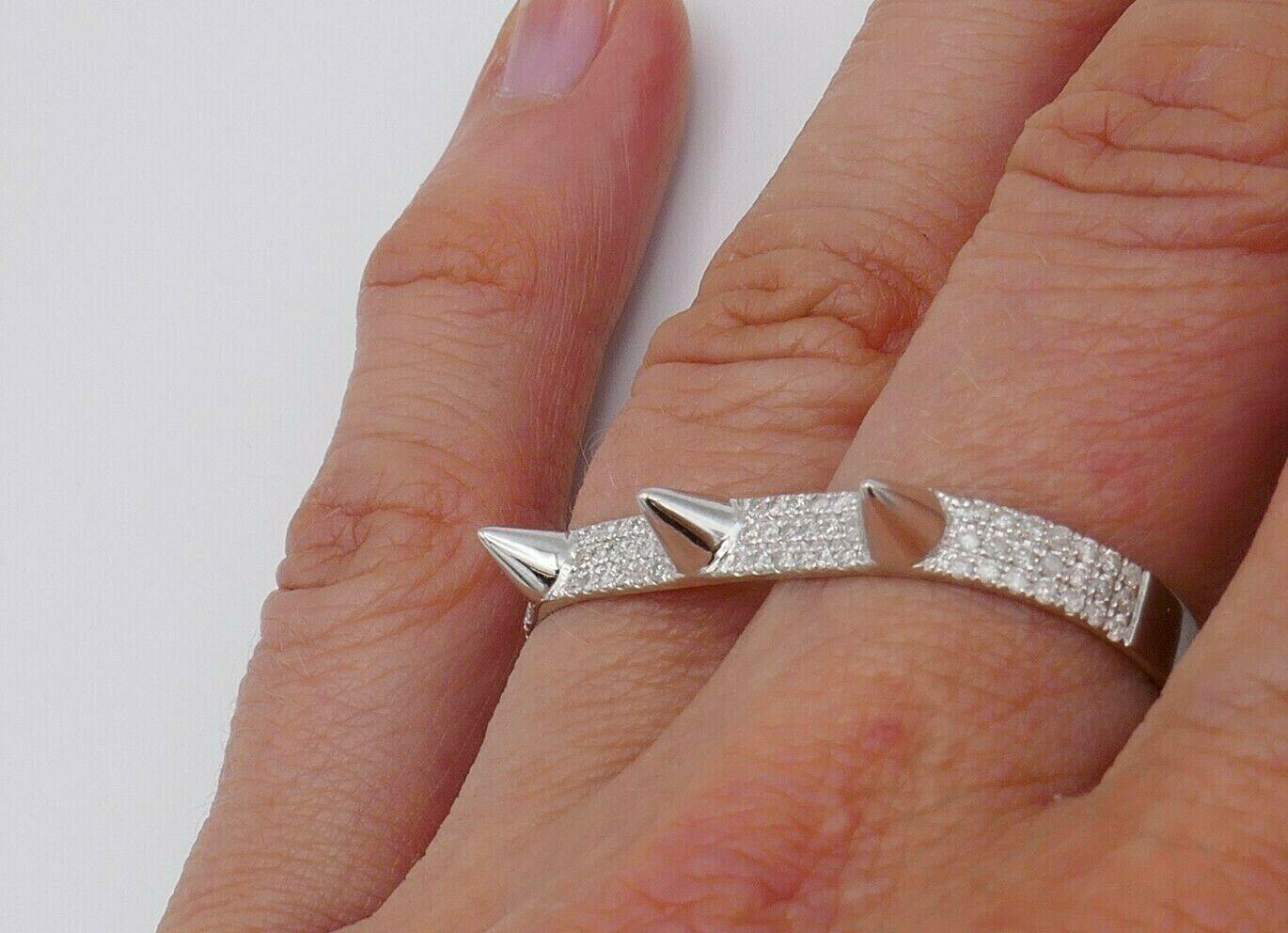 Modern 18k white gold Spike two-finger ring by Elise Dray. Featuring 0.43 points of round brilliant cut diamonds.  Stamped with  Elise Dray maker's marks and a hallmark for 18k gold. 
Measurements: rings sizes are 5.75 and 6.75. Band width is 0.15