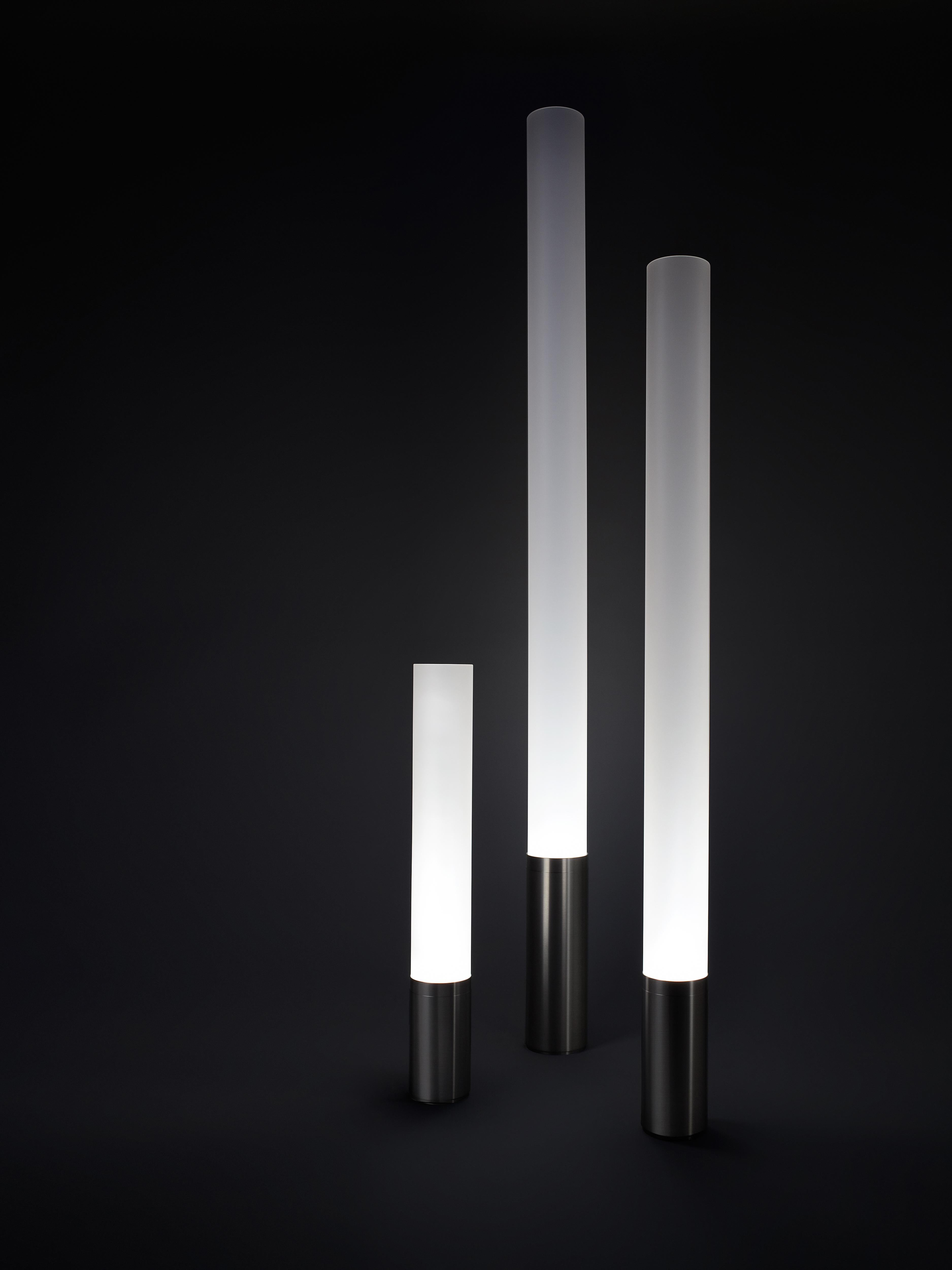 The timeless Elise lamp pays tribute to the advent of the machine age. Its refined machined aluminum base combined with its towering frosted acrylic diffuser serves as the perfect combination for elegant lighting. Elise features full-range dimming