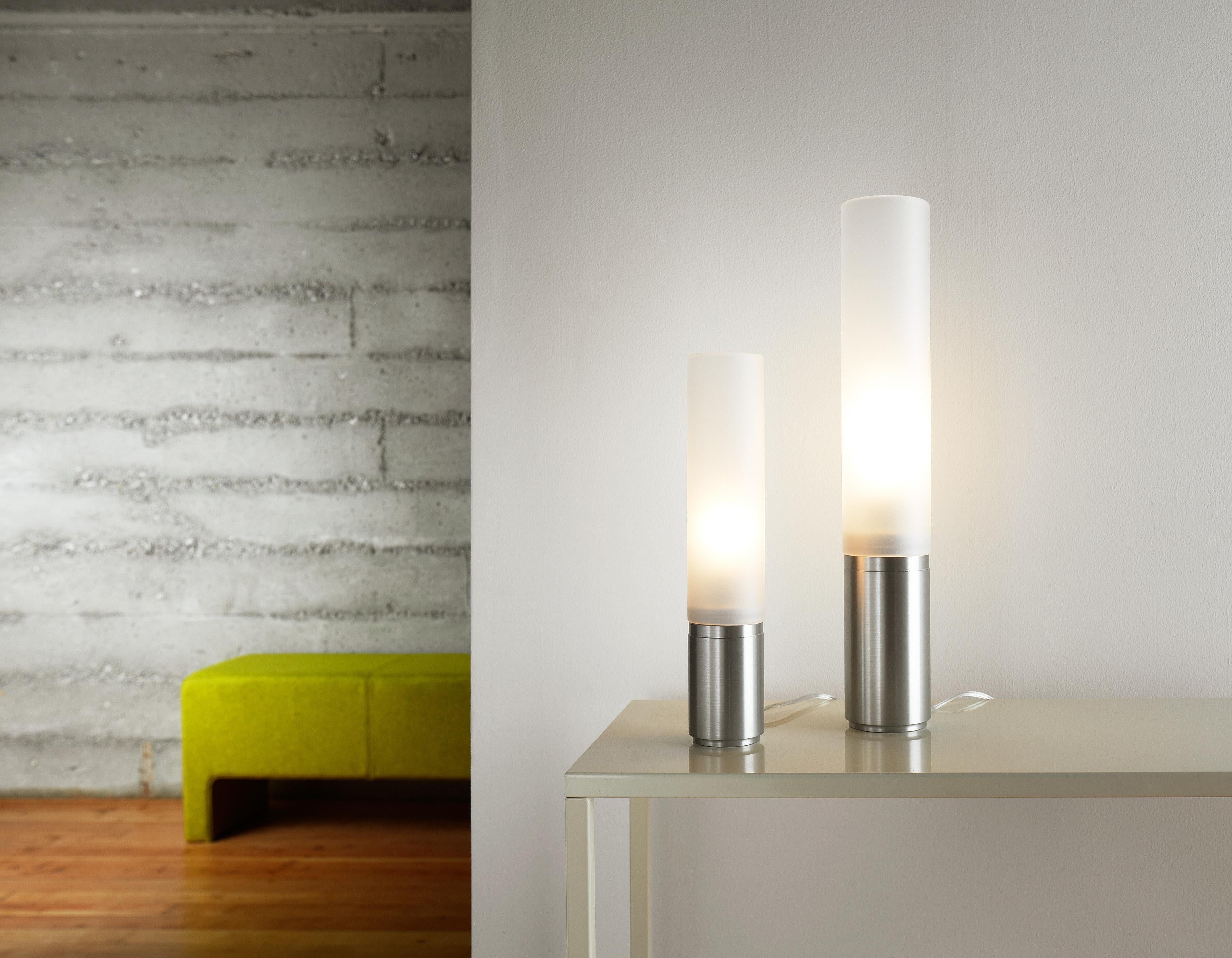The timeless Elise lamp pays tribute to the advent of the machine age. Its refined machined aluminum base combined with its towering frosted acrylic diffuser serves as the perfect combination for elegant lighting. Elise features full-range dimming