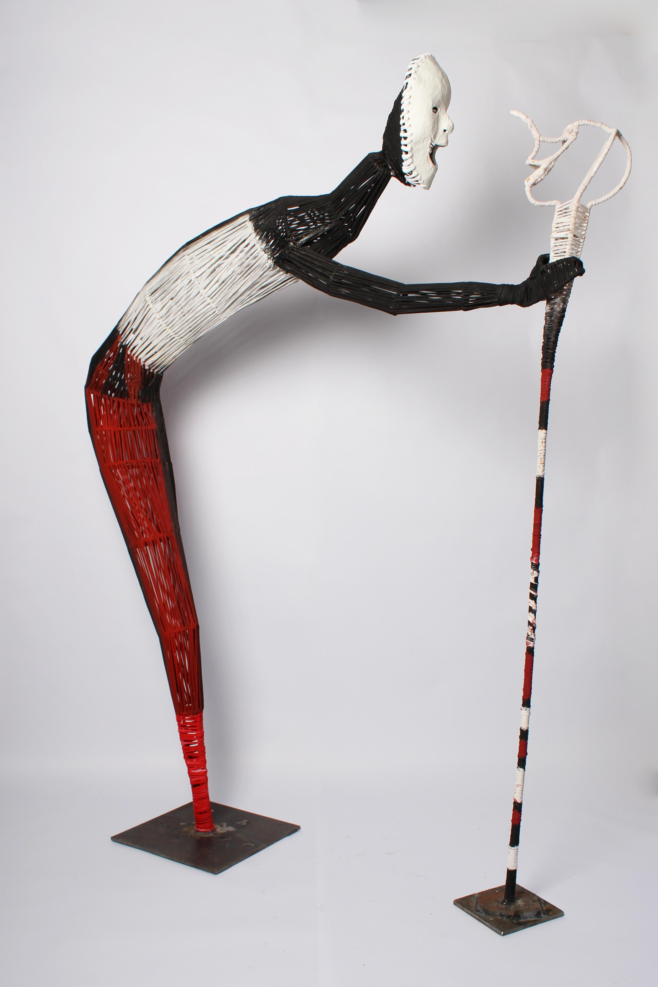 Le bâton de marche, sculpture technique mixte d'Elisia Nghidishange