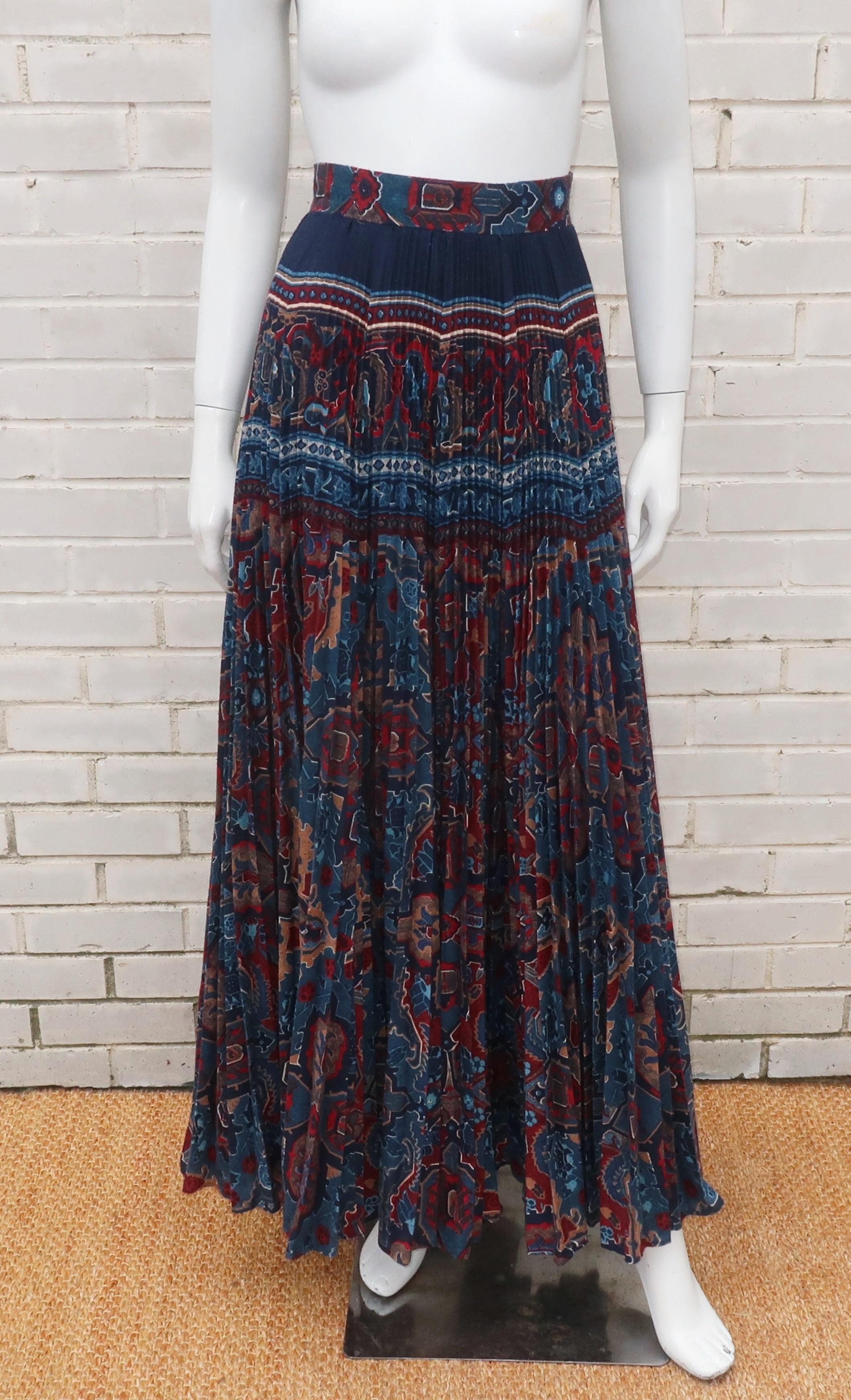 Get a little 1970's California cool with this maxi micro pleated skirt by Elissa in a bohemian print accented by shades of dark blue, ocean blue, tan and brick red.  The panels of fabric are cleverly cut to create a pattern near the waistband that